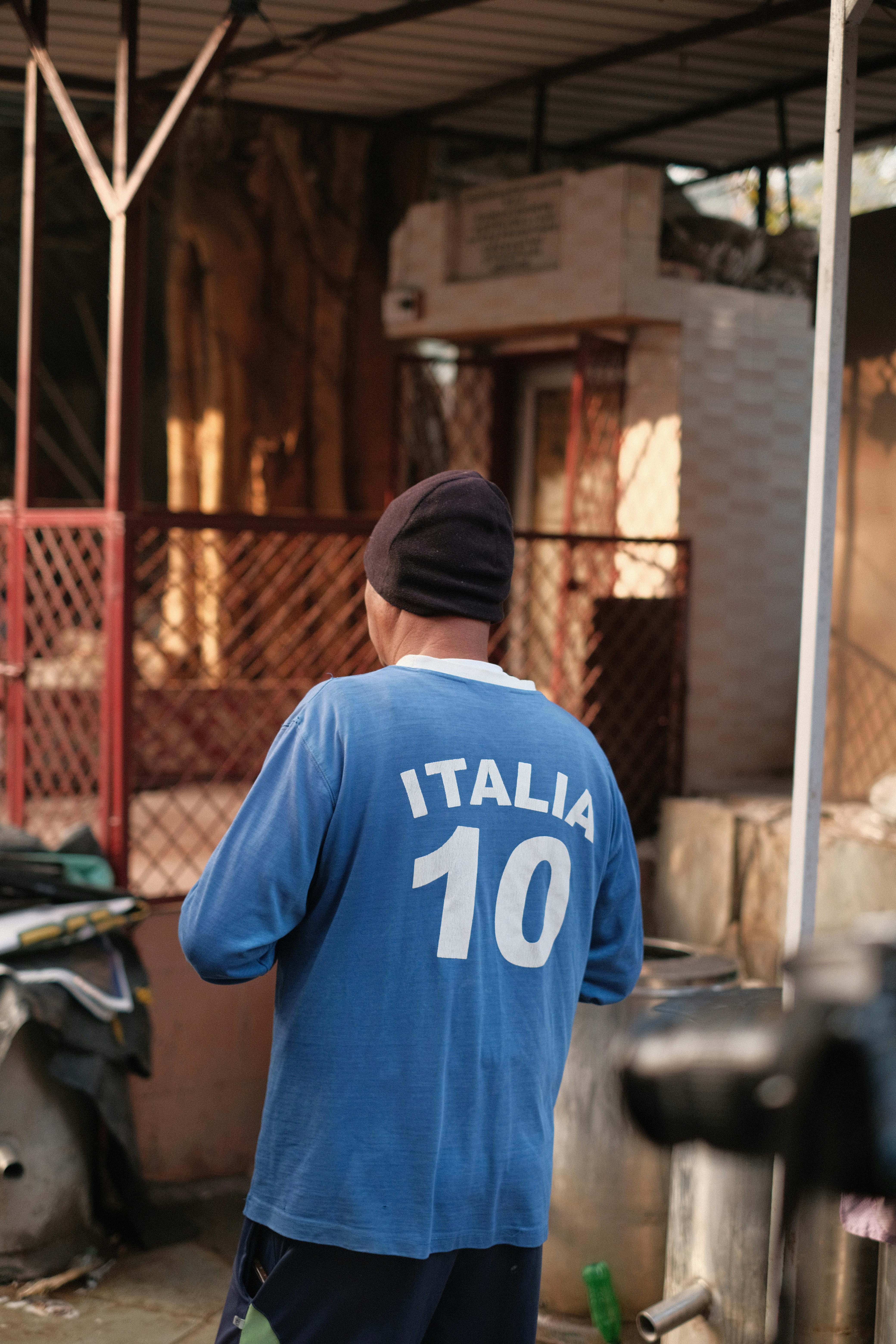 Man wearing a blue italia number 10 shirt.