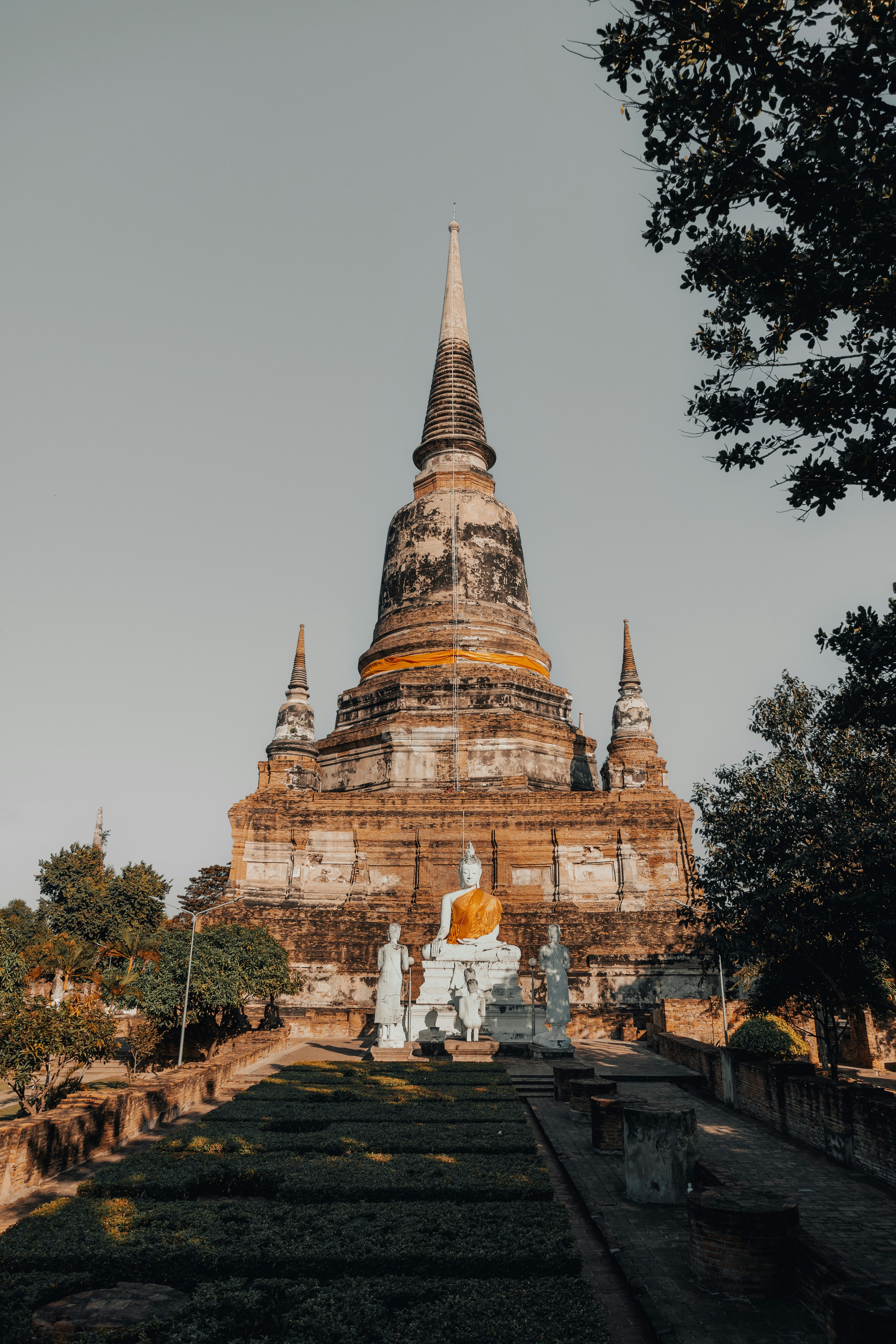 Ancient temple with buddha statues under clear sky