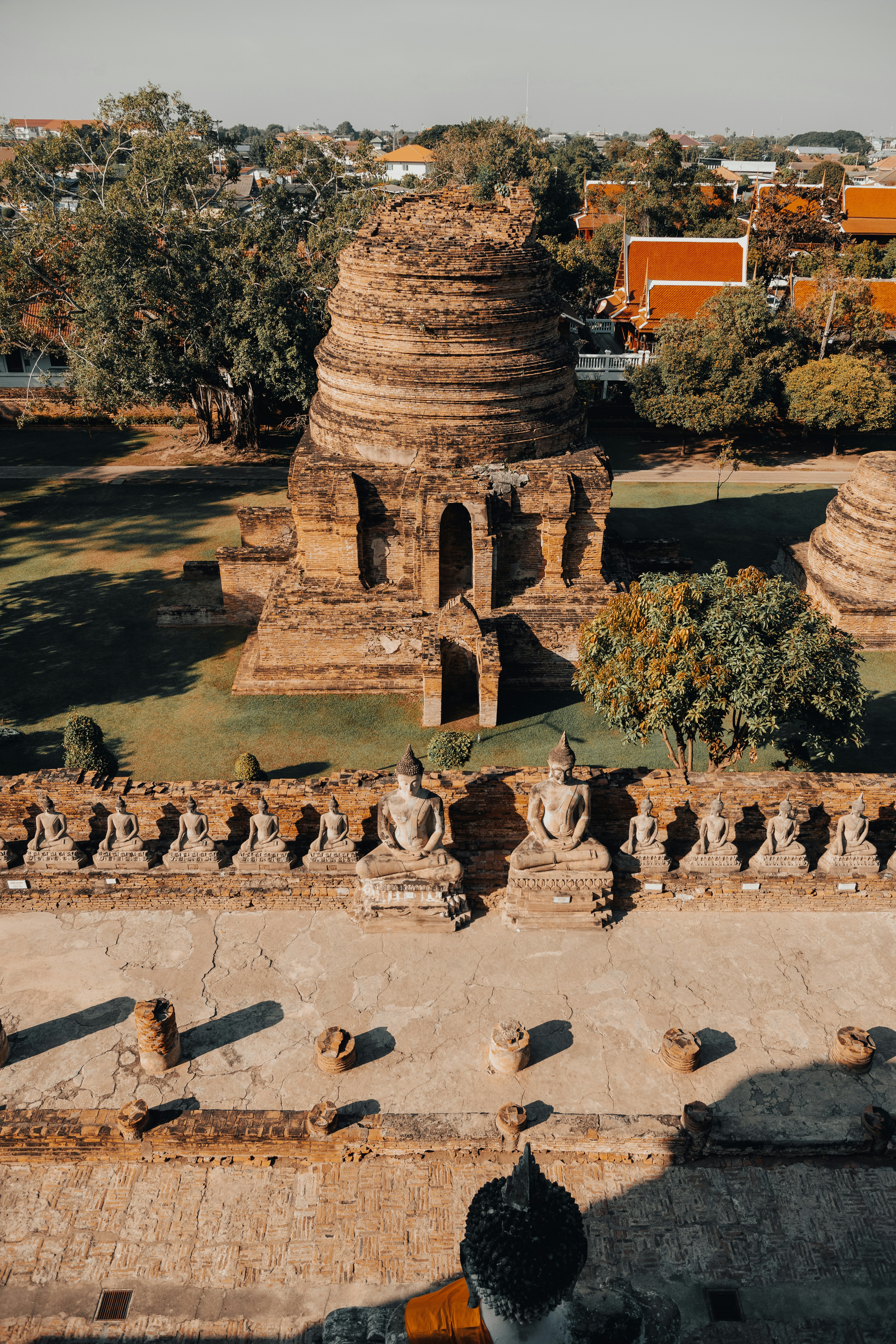 Ancient temple ruins with rows of buddha statues.