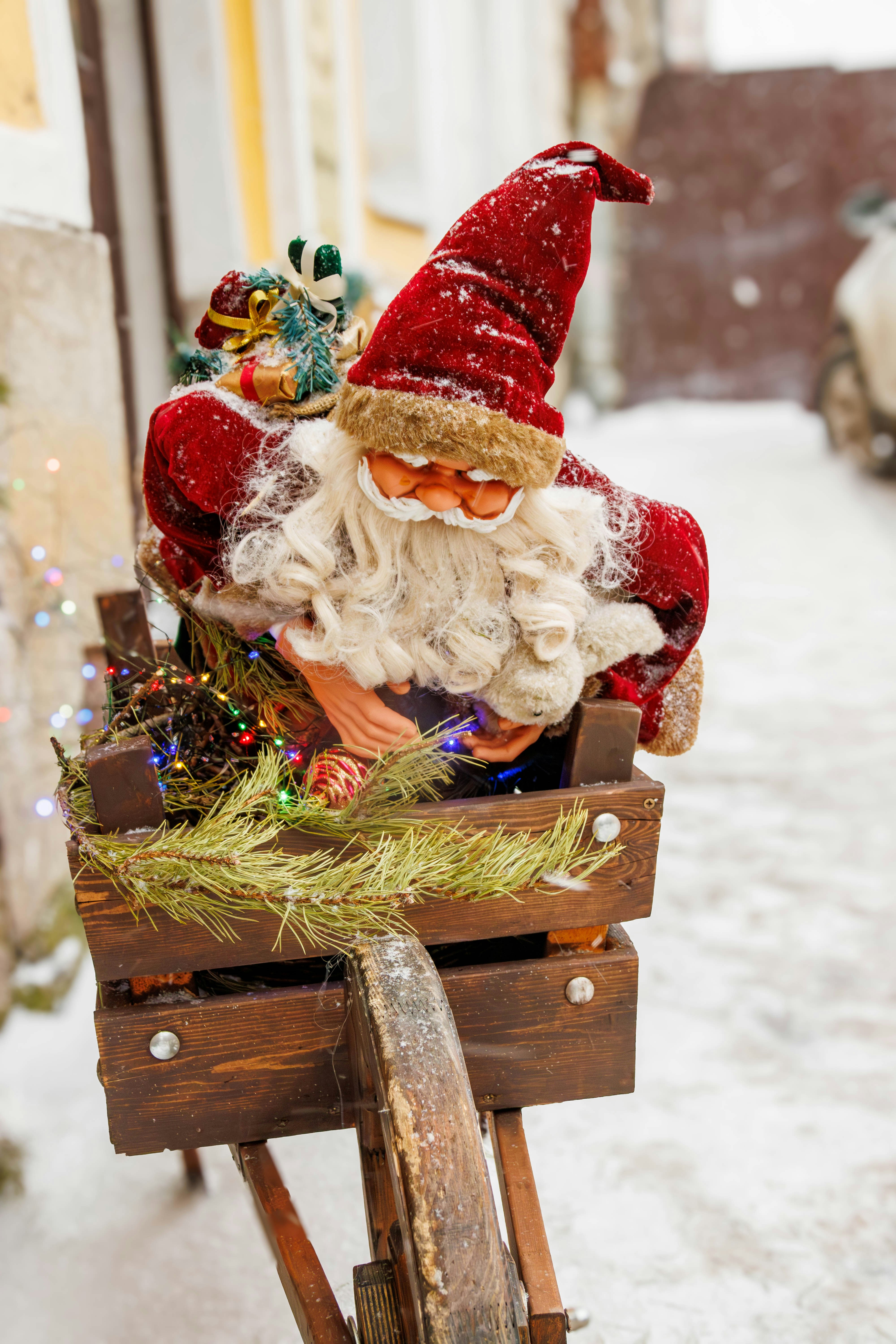 Santa claus decoration in a wooden cart