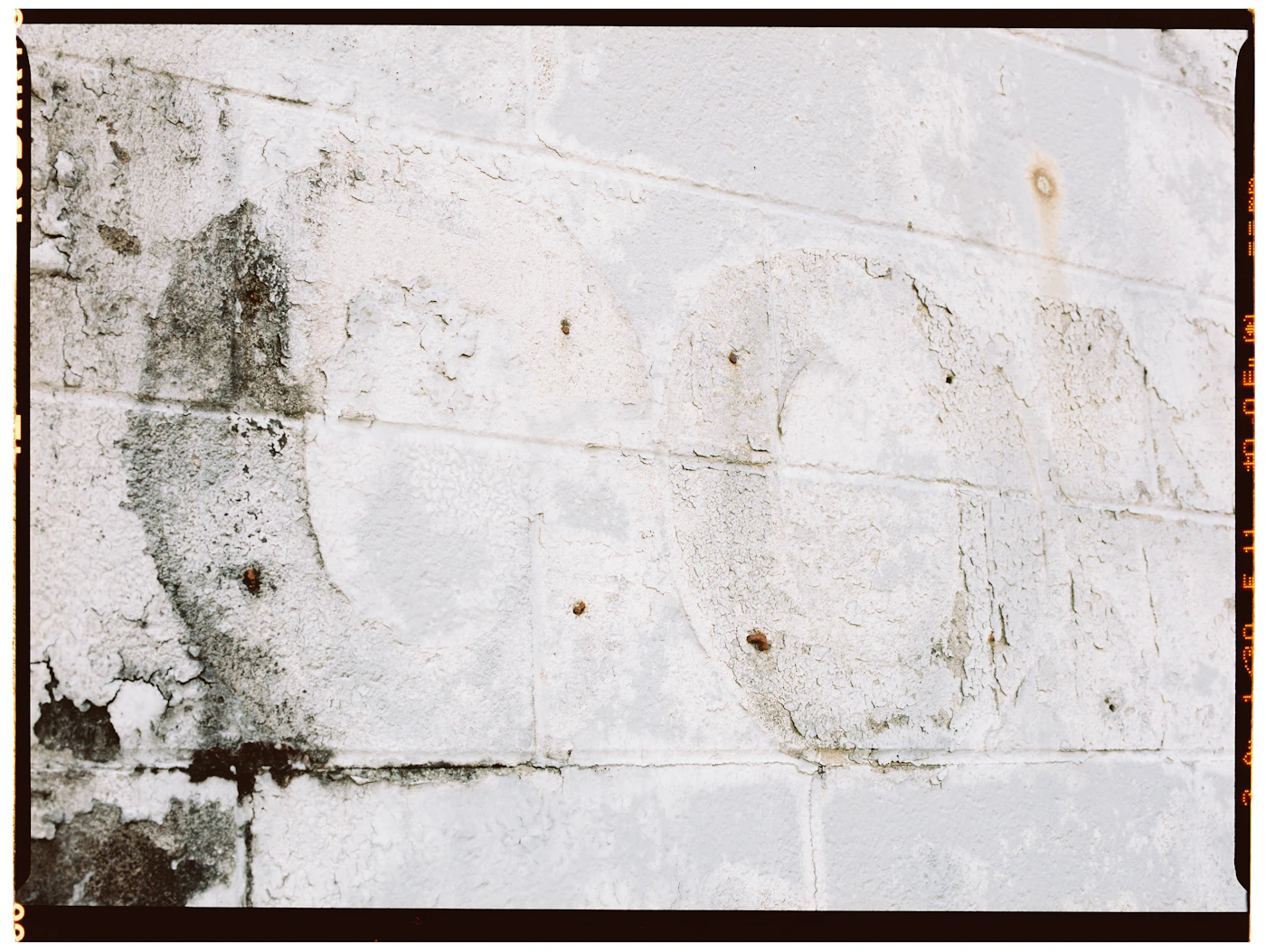 Weathered wall with moisture staining, a warning sign of a hidden leak