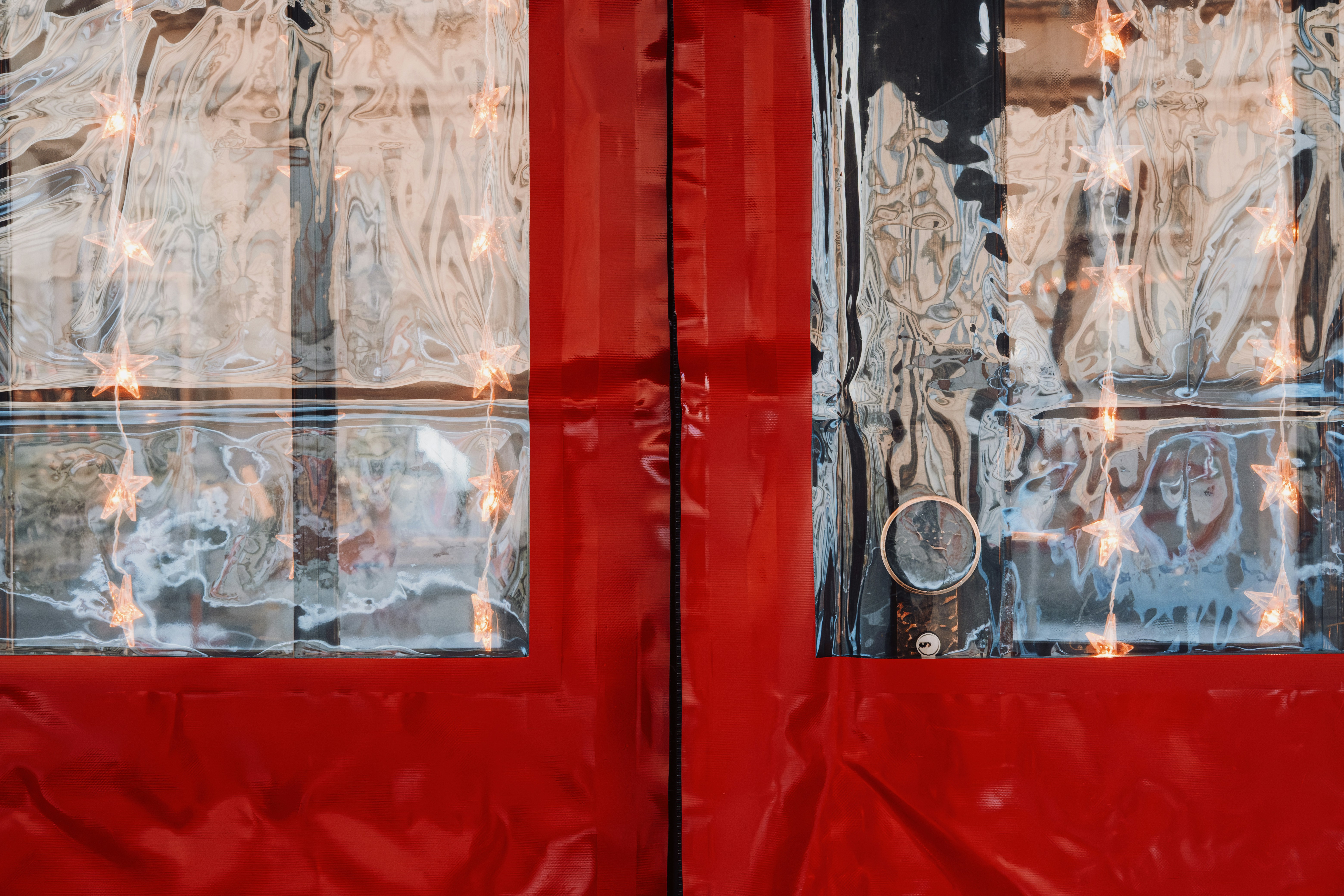 Red doors with clear plastic and lights