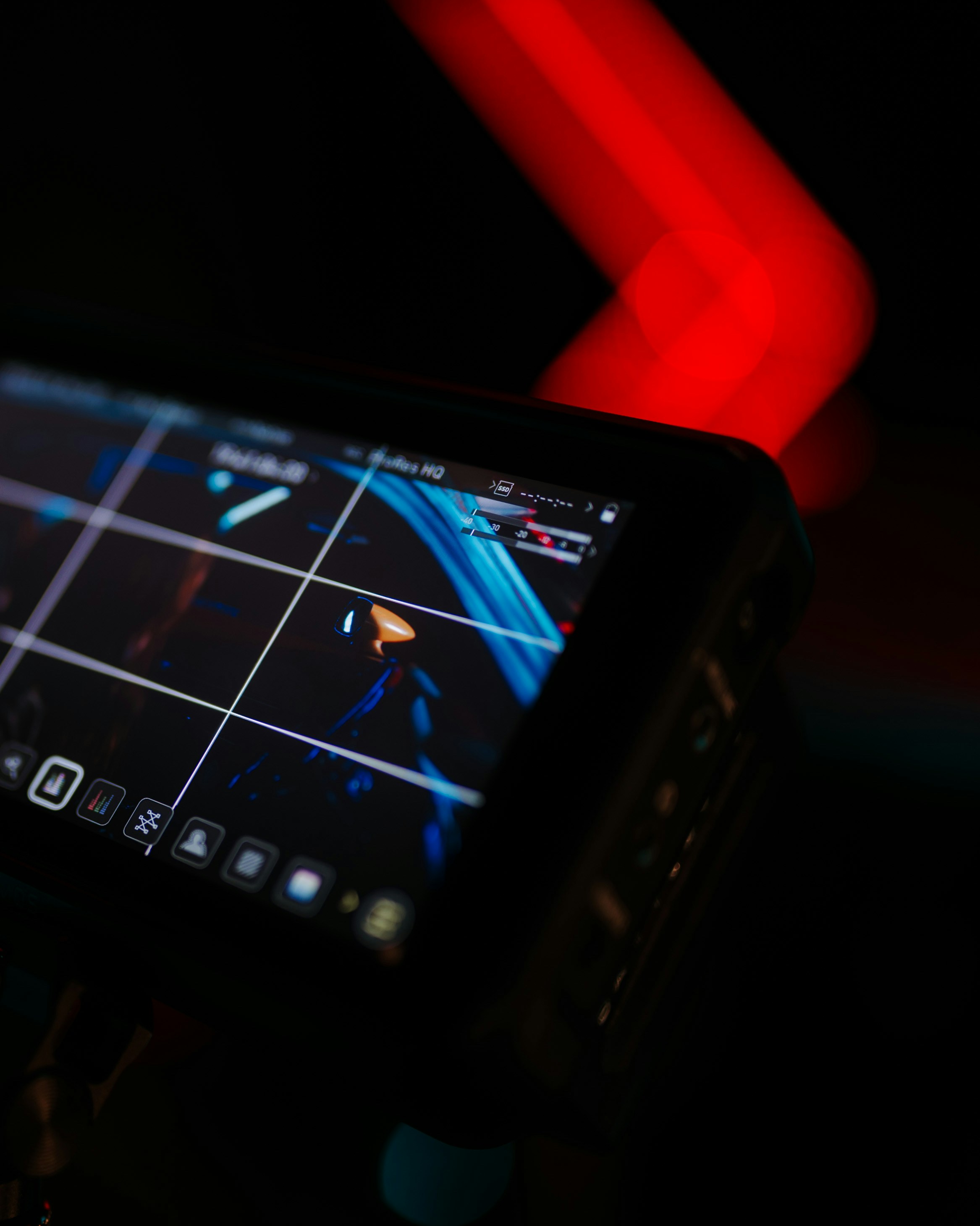 Close-up of a digital screen displaying graphics at night.