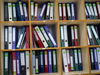 Shelves filled with colorful binders and folders.