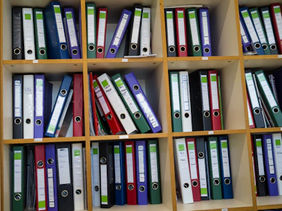 Shelves filled with colorful binders and folders.