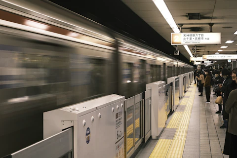 A train arriving at a subway station platform.
