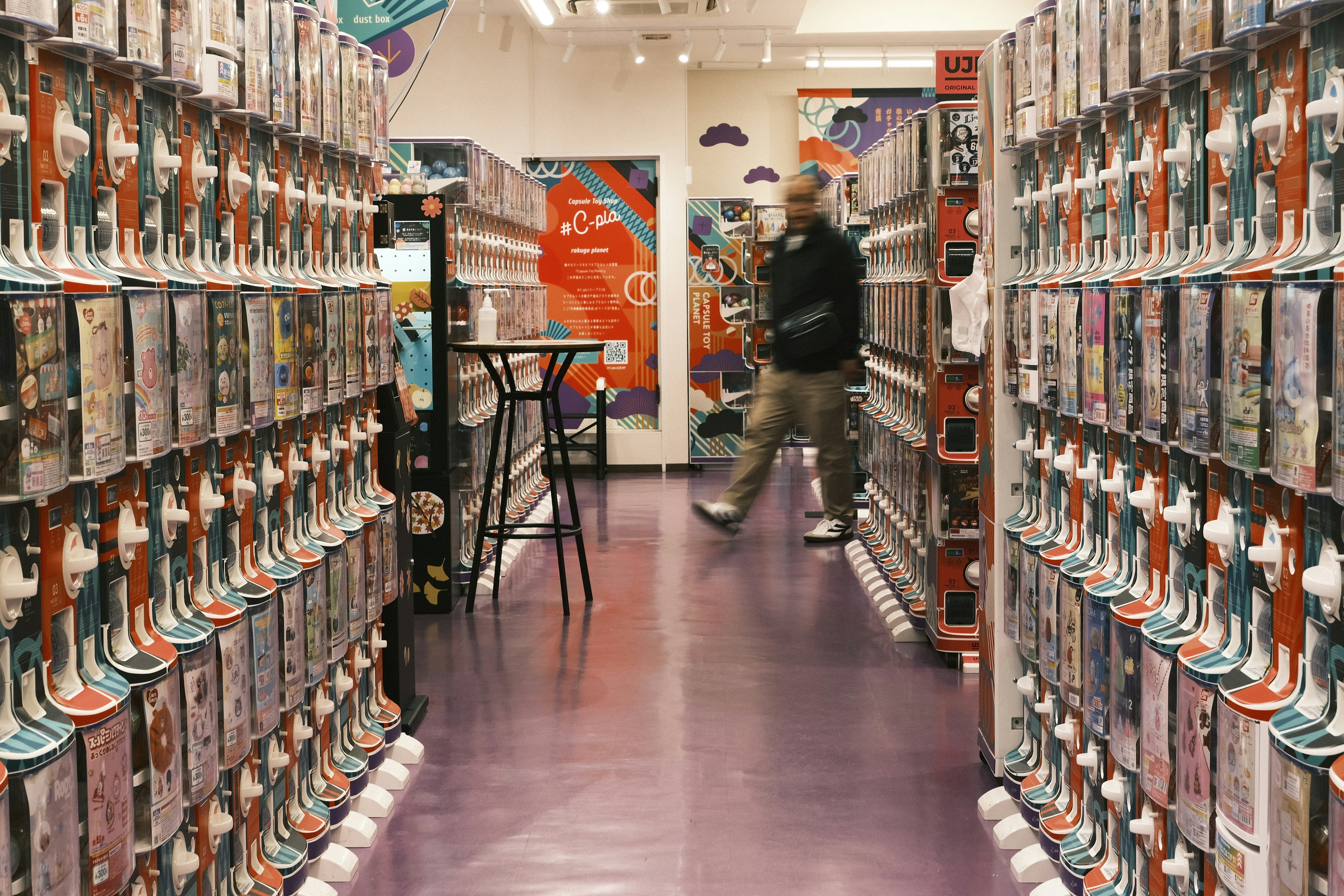 Man walks down aisle of video game store