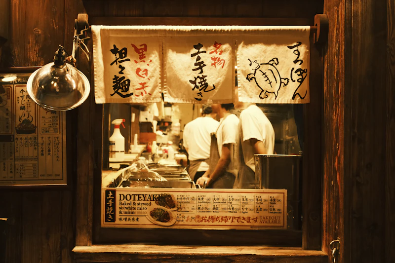 Japanese chefs preparing food at a live cooking station