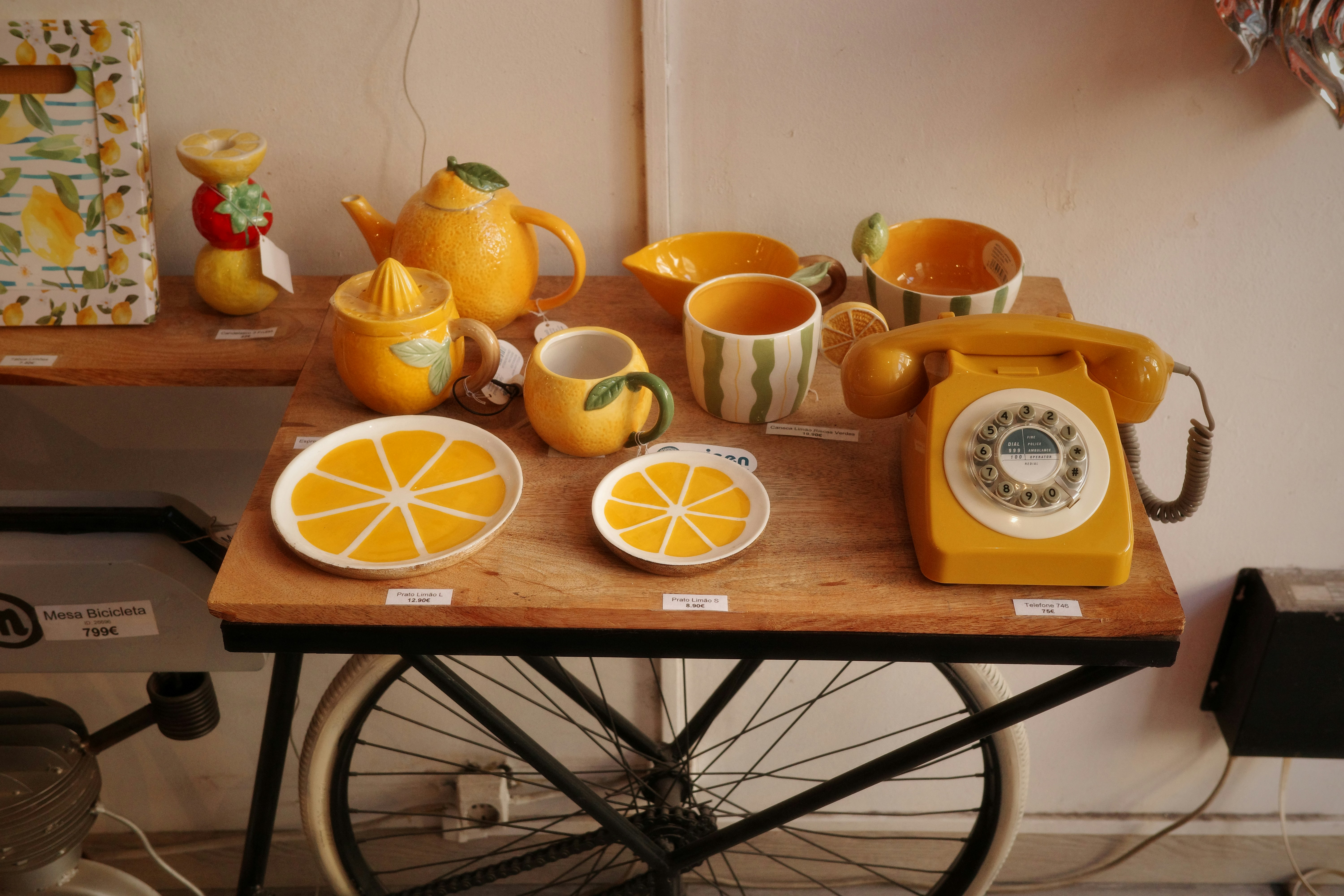 Yellow kitchenware and vintage phone display