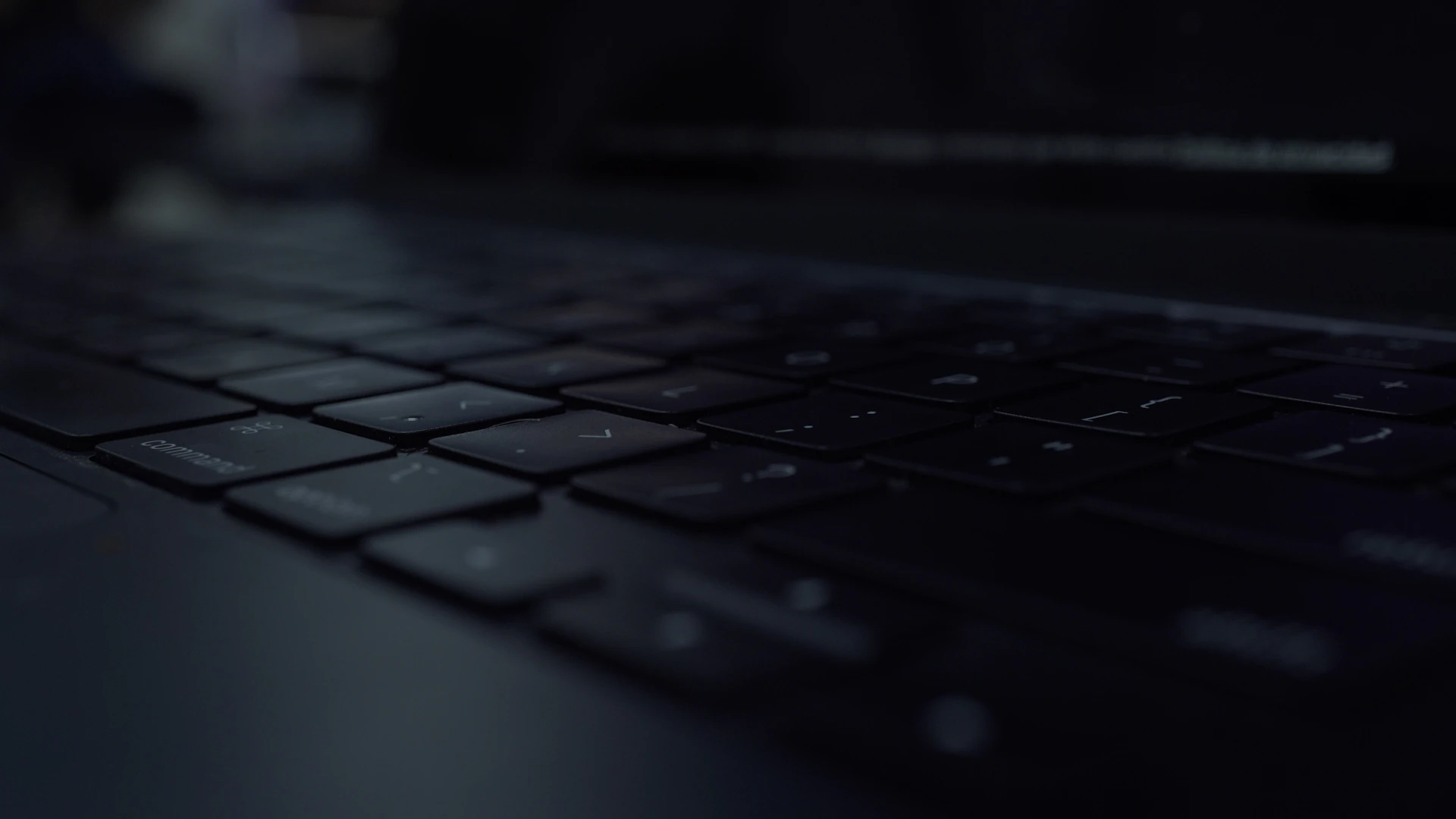 Close-up of a dark laptop keyboard
