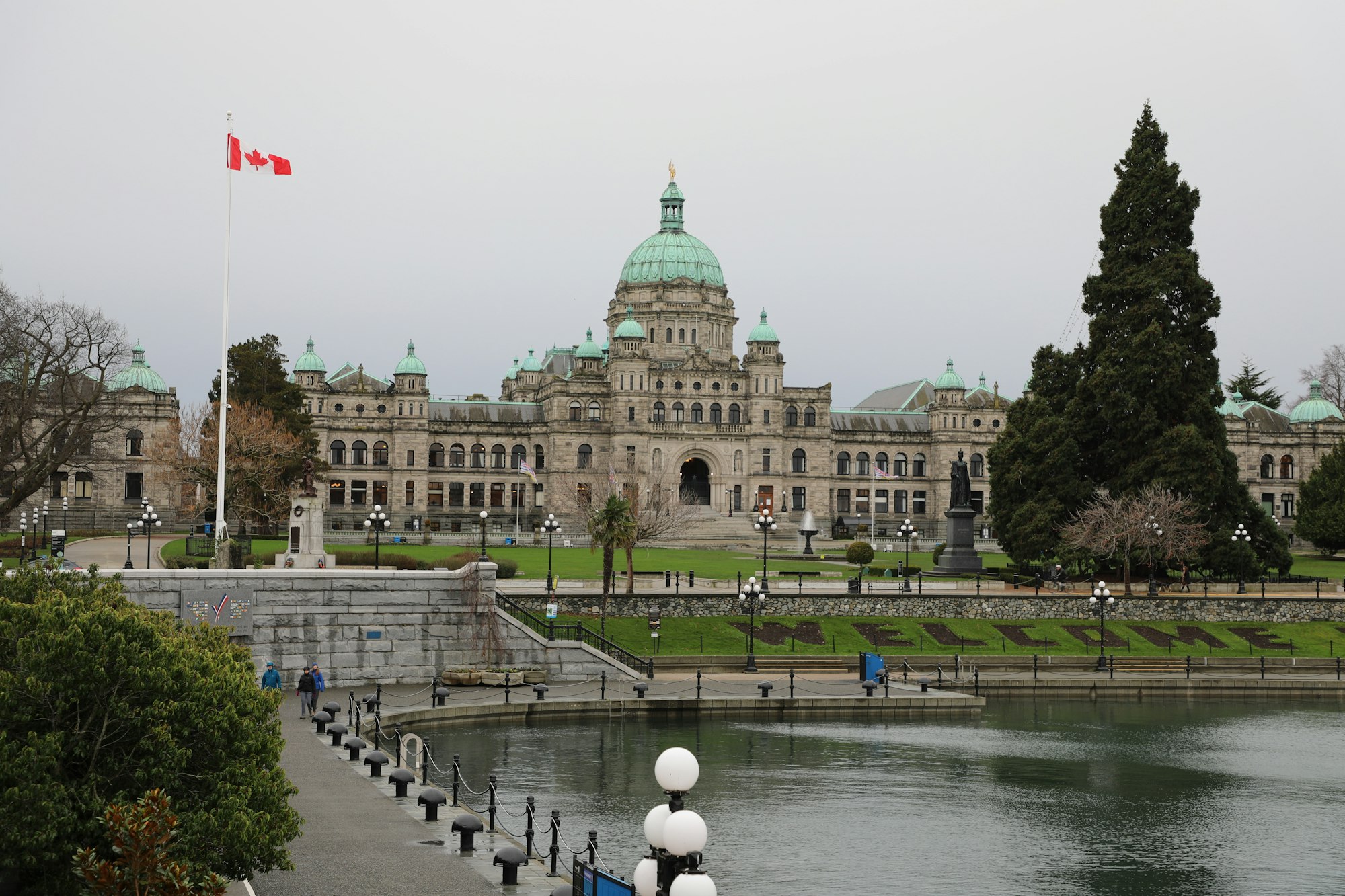 Canadian parliament building beside a reflective body of water