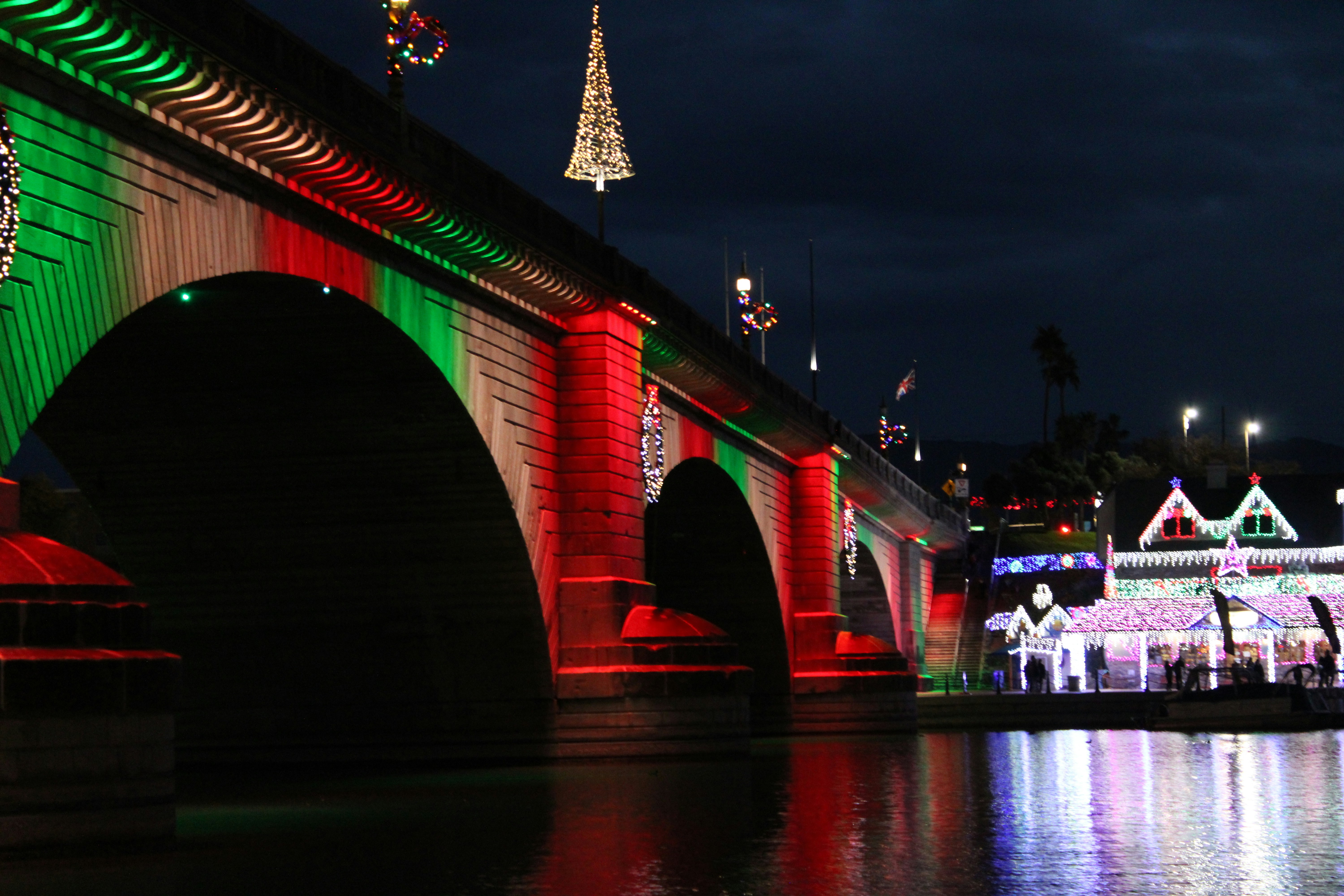 Bridge decorated with christmas lights at night