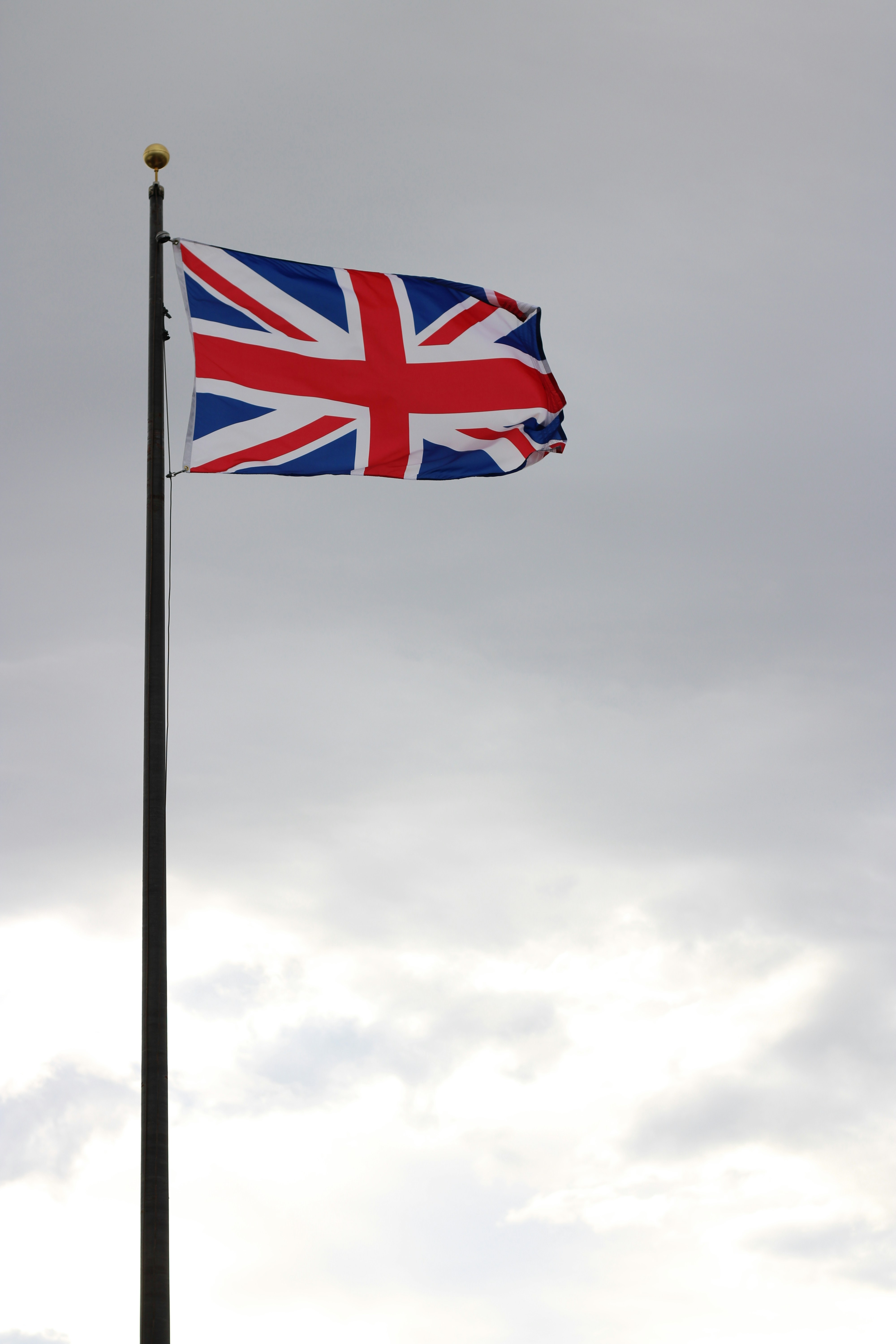 Union jack flag waving on a flagpole
