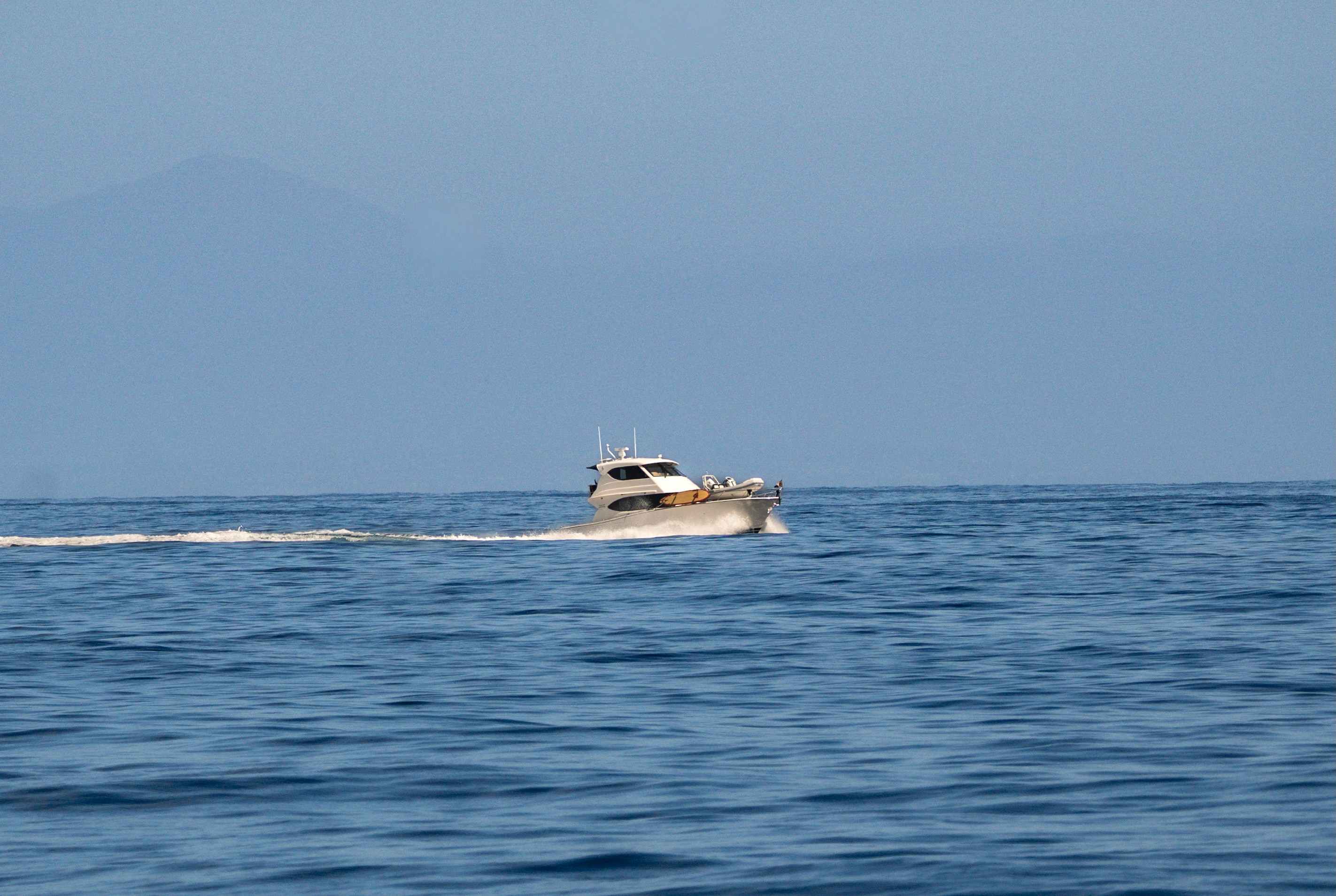 center console boat on the water powered by an outboard - rebuilt outboard motors for sale