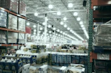 A wide aisle in a brightly lit warehouse store.