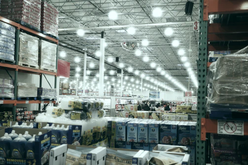 A wide aisle in a brightly lit warehouse store.