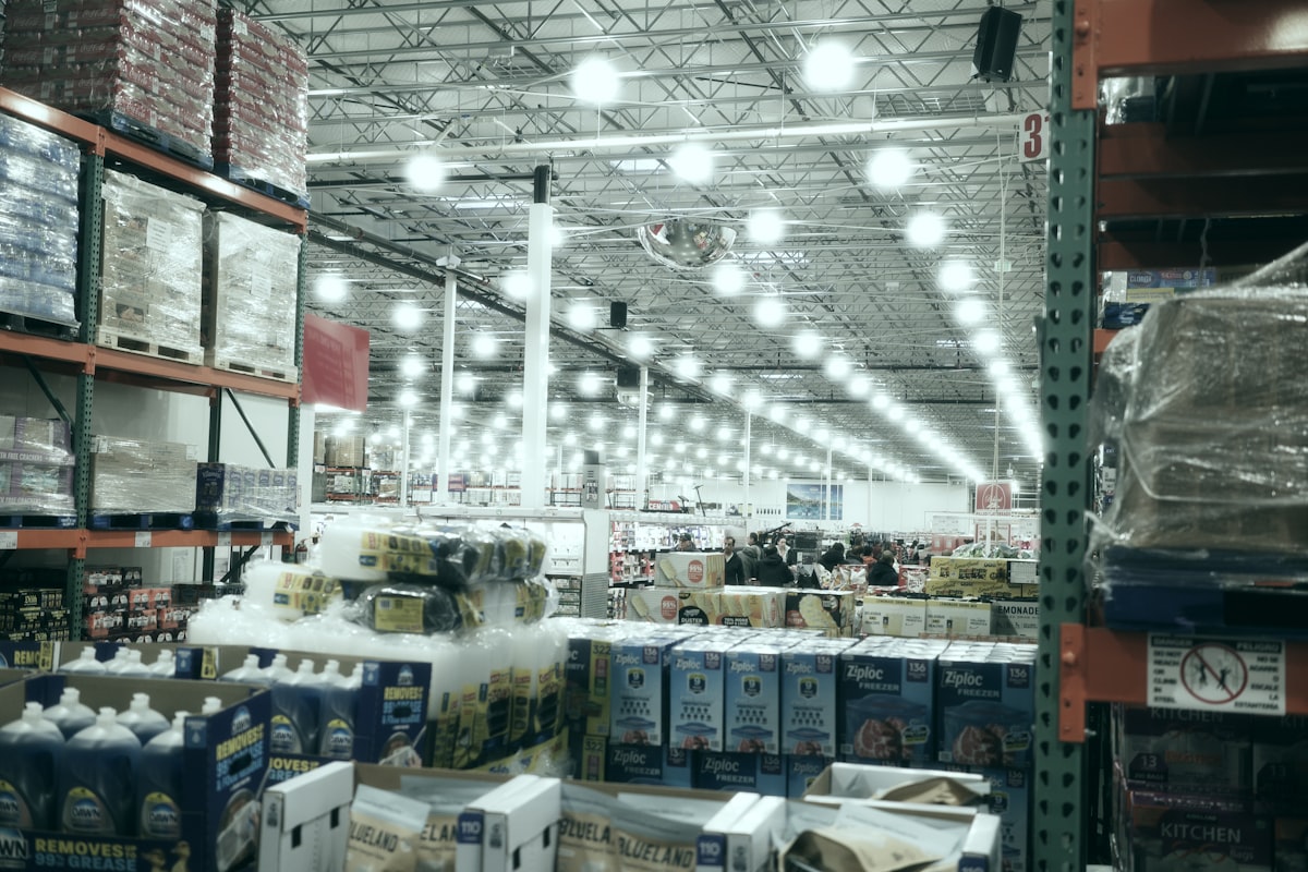 Interior of a brightly lit retail store aisle, representing the commercial properties Realty Income owns across its portfolio