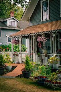 Charming house with a white picket fence and flowers.