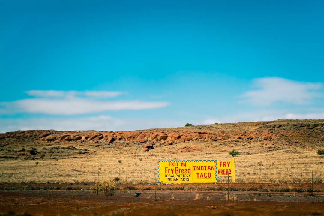 Yellow sign advertises fry bread and tacos