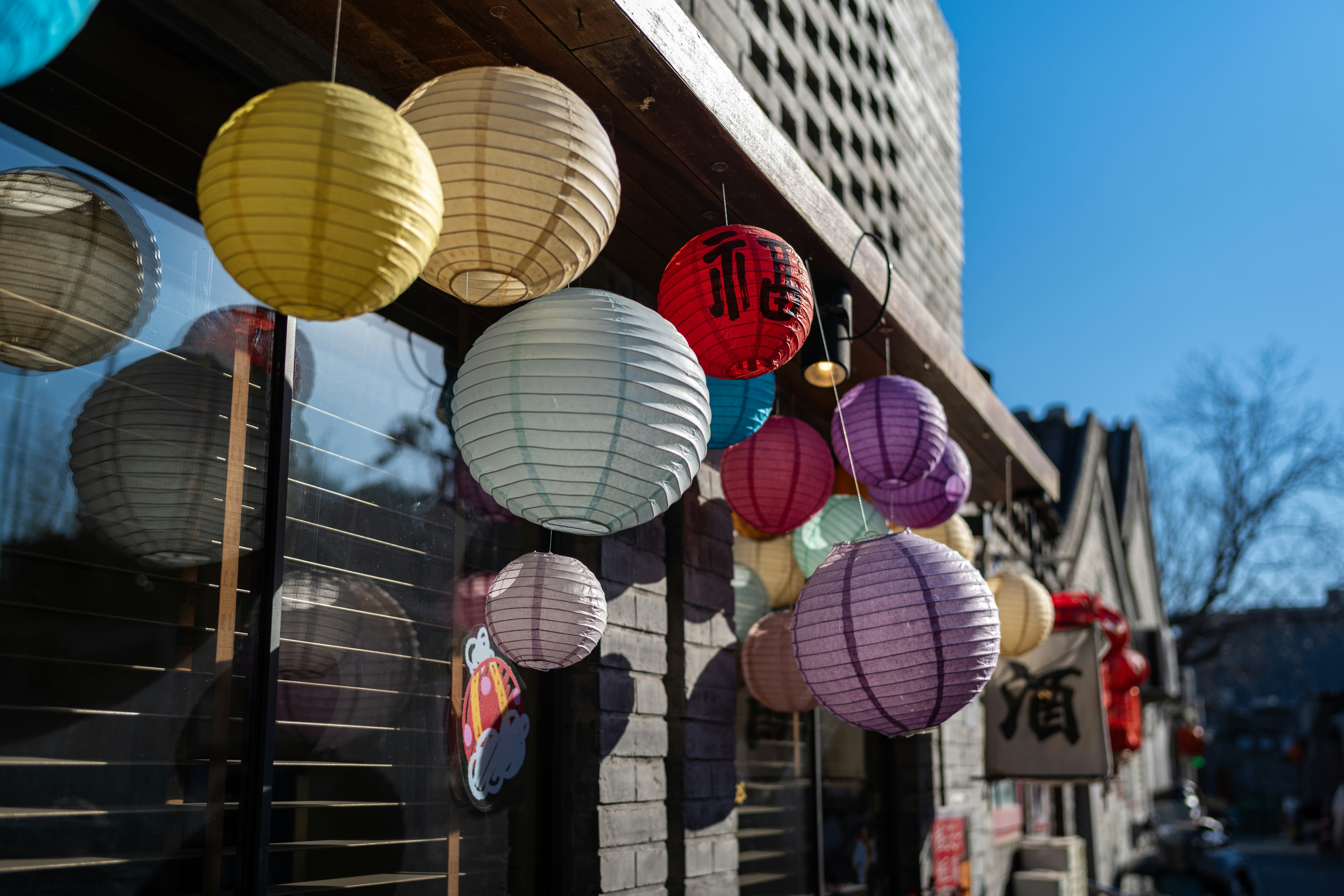 Colorful lanterns hanging outside a building