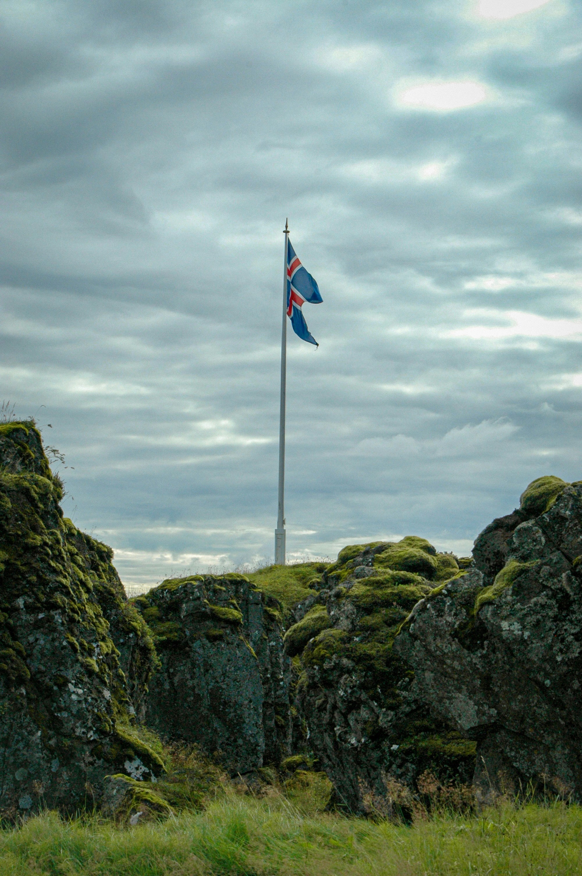 Icelandic flag flying high on a hill