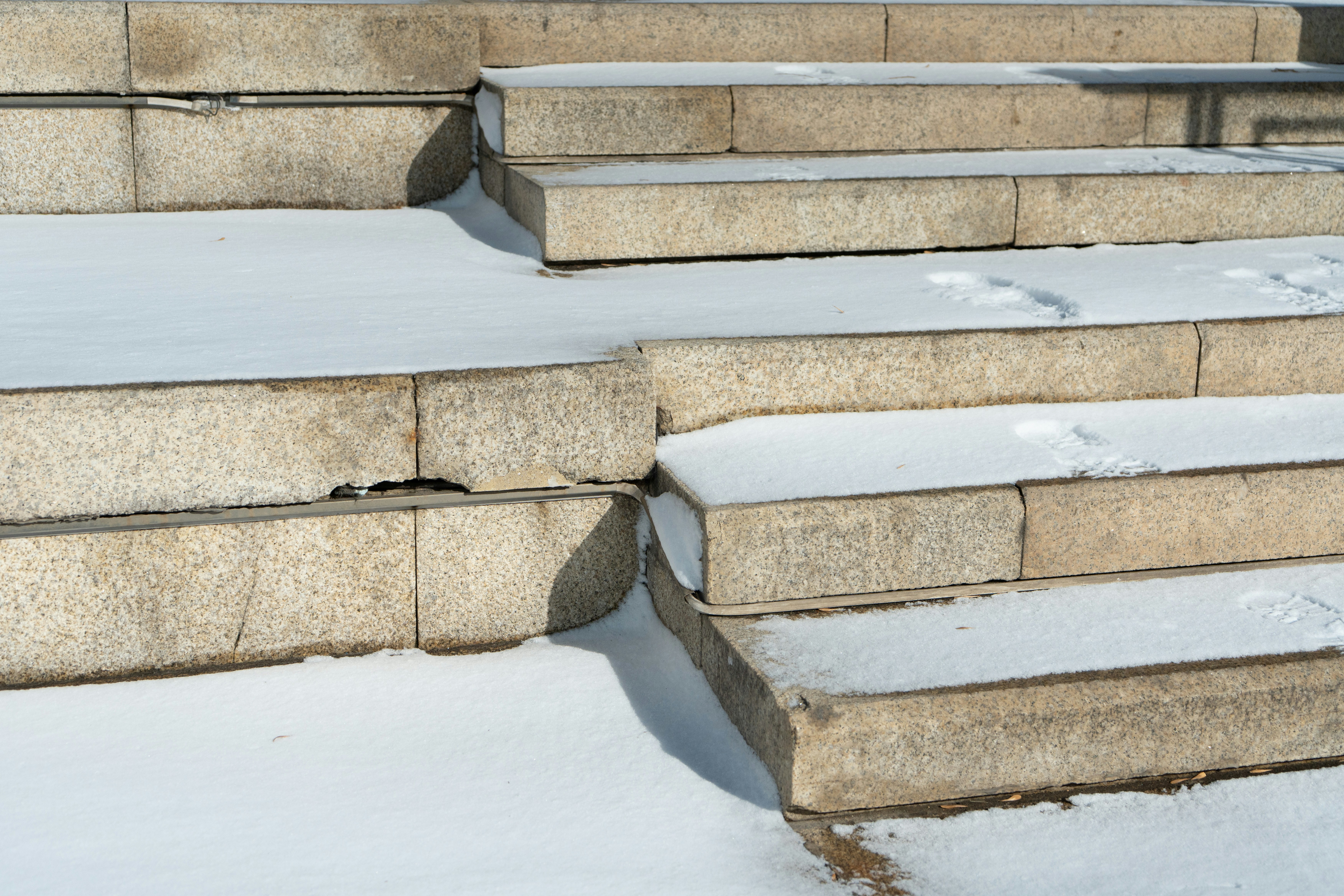 Stone steps covered in a light dusting of snow