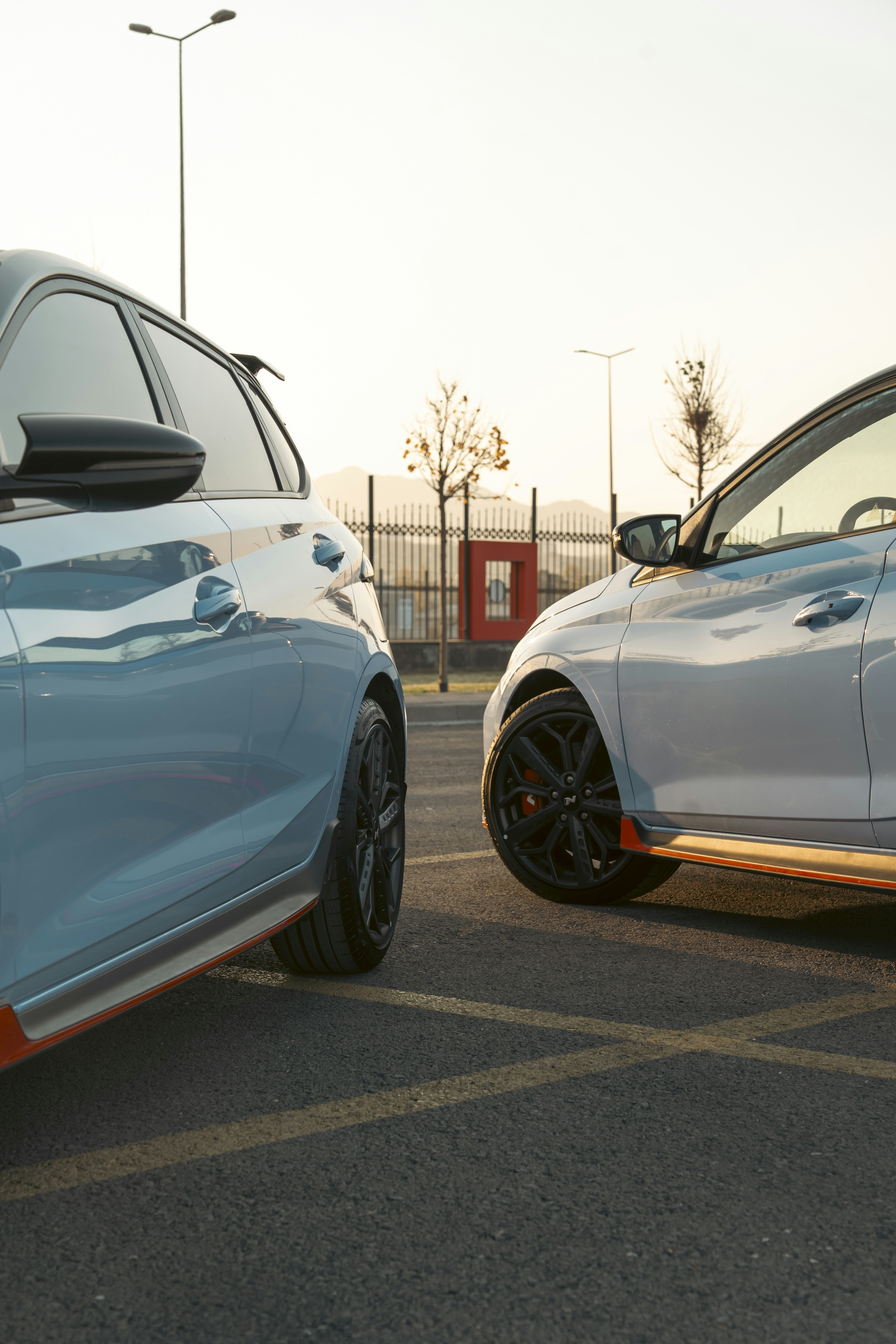 Two cars parked side by side outdoors