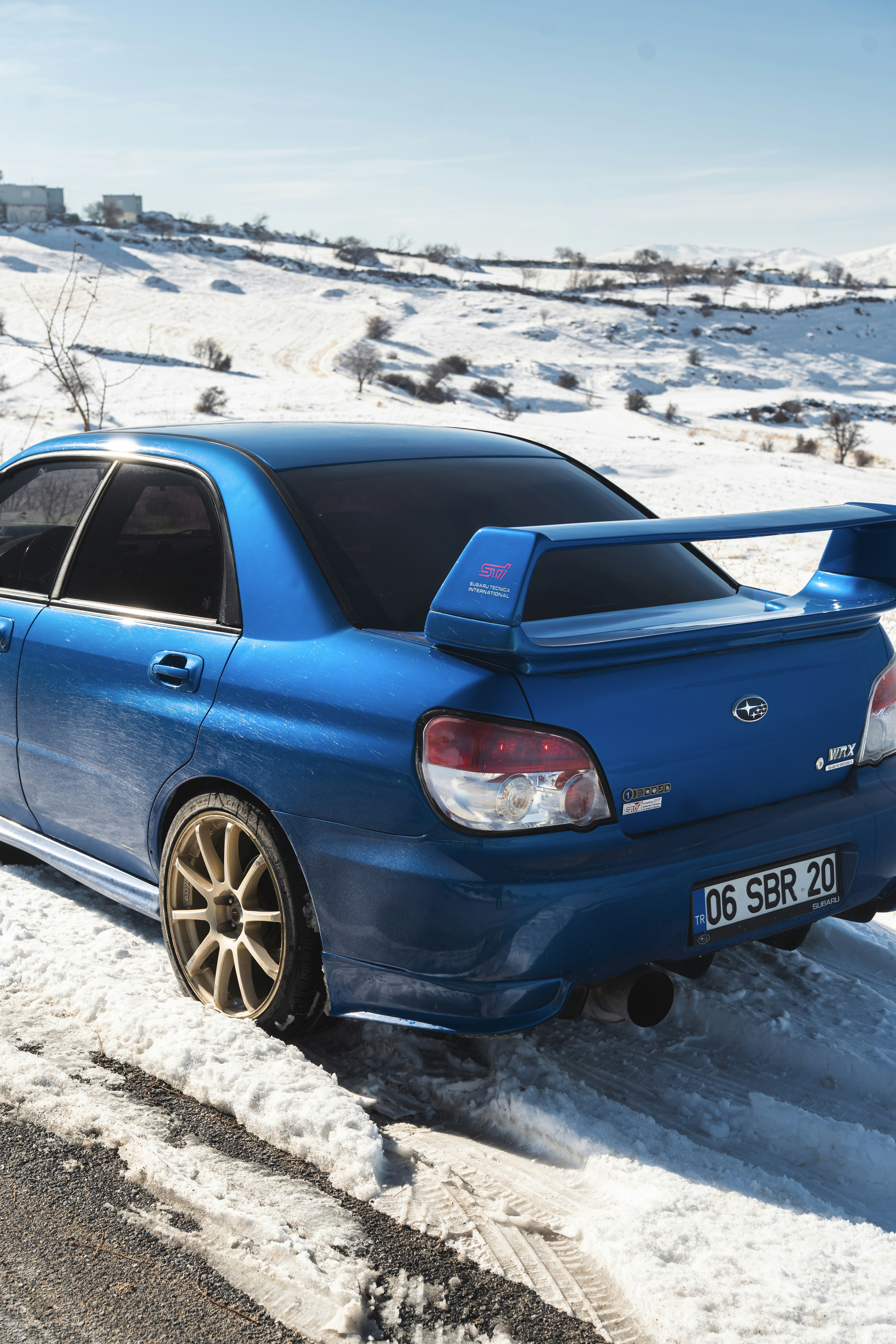 Blue subaru wrx sti in the snow