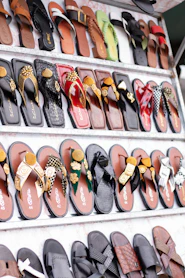 Display of various colorful sandals and flip-flops