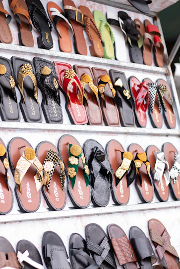 Display of various colorful sandals and flip-flops