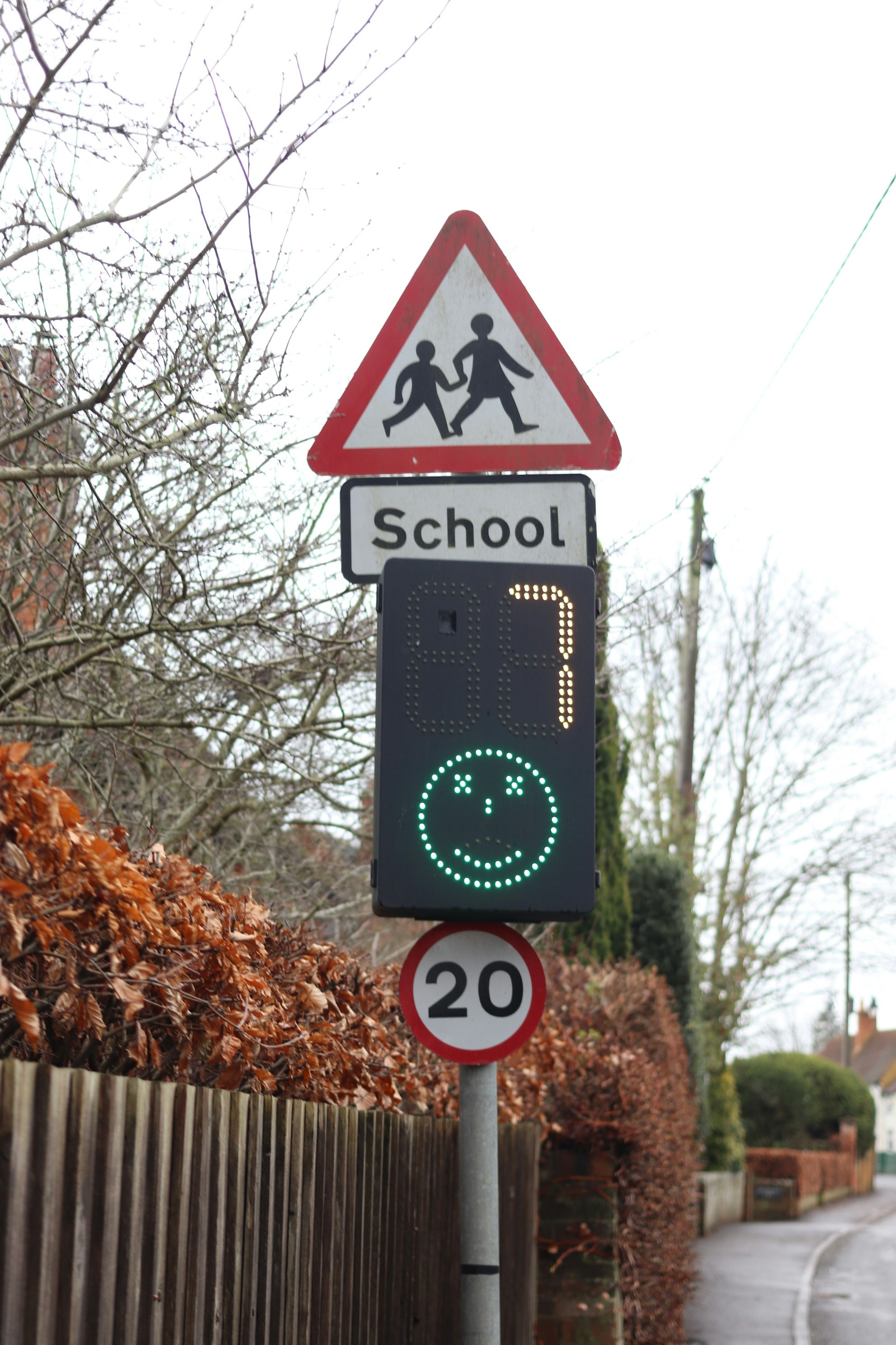 School warning sign with a smiley face.