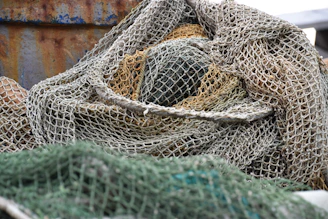 Pile of fishing nets with rusty background