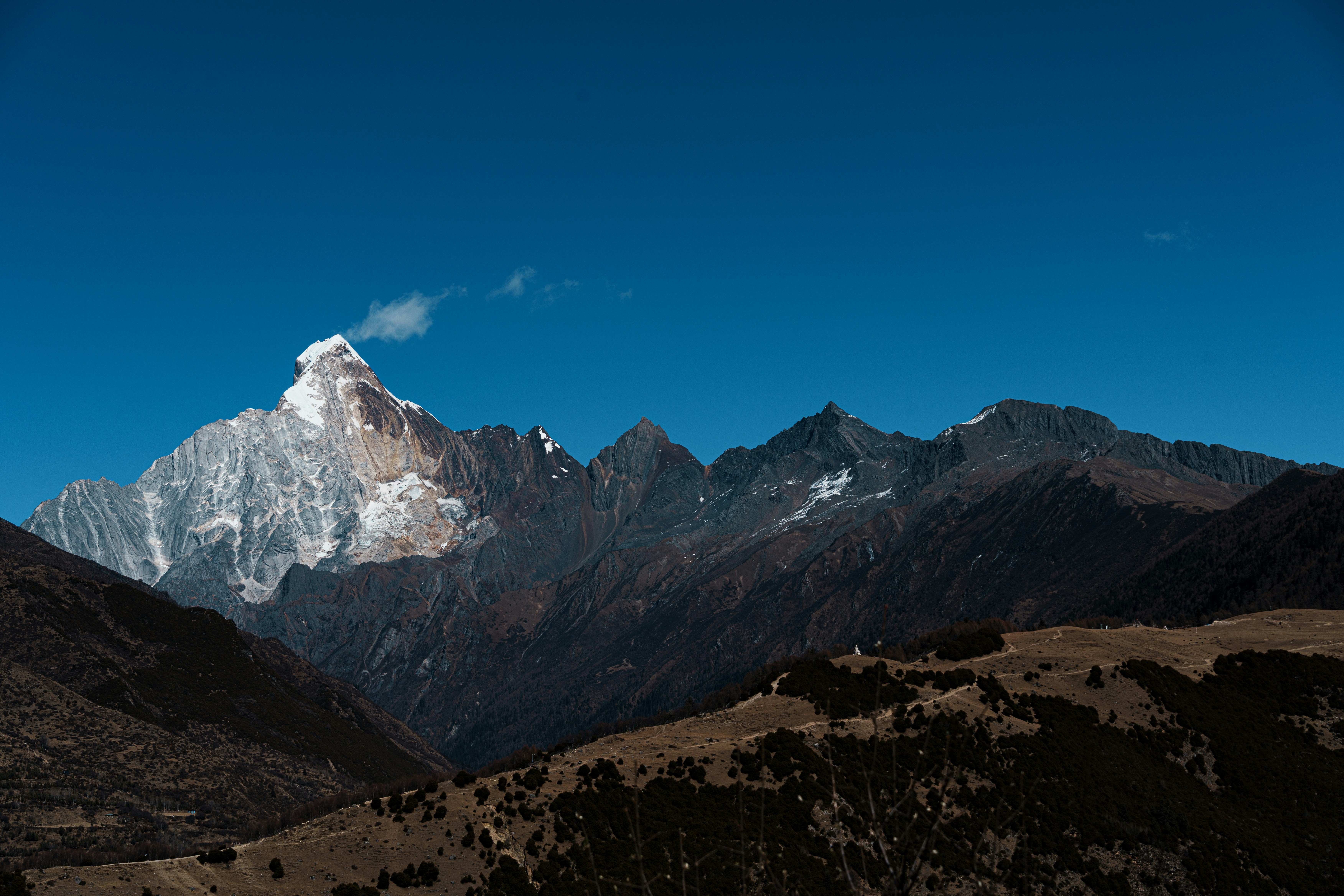 Snow-capped mountain peak under a clear blue sky