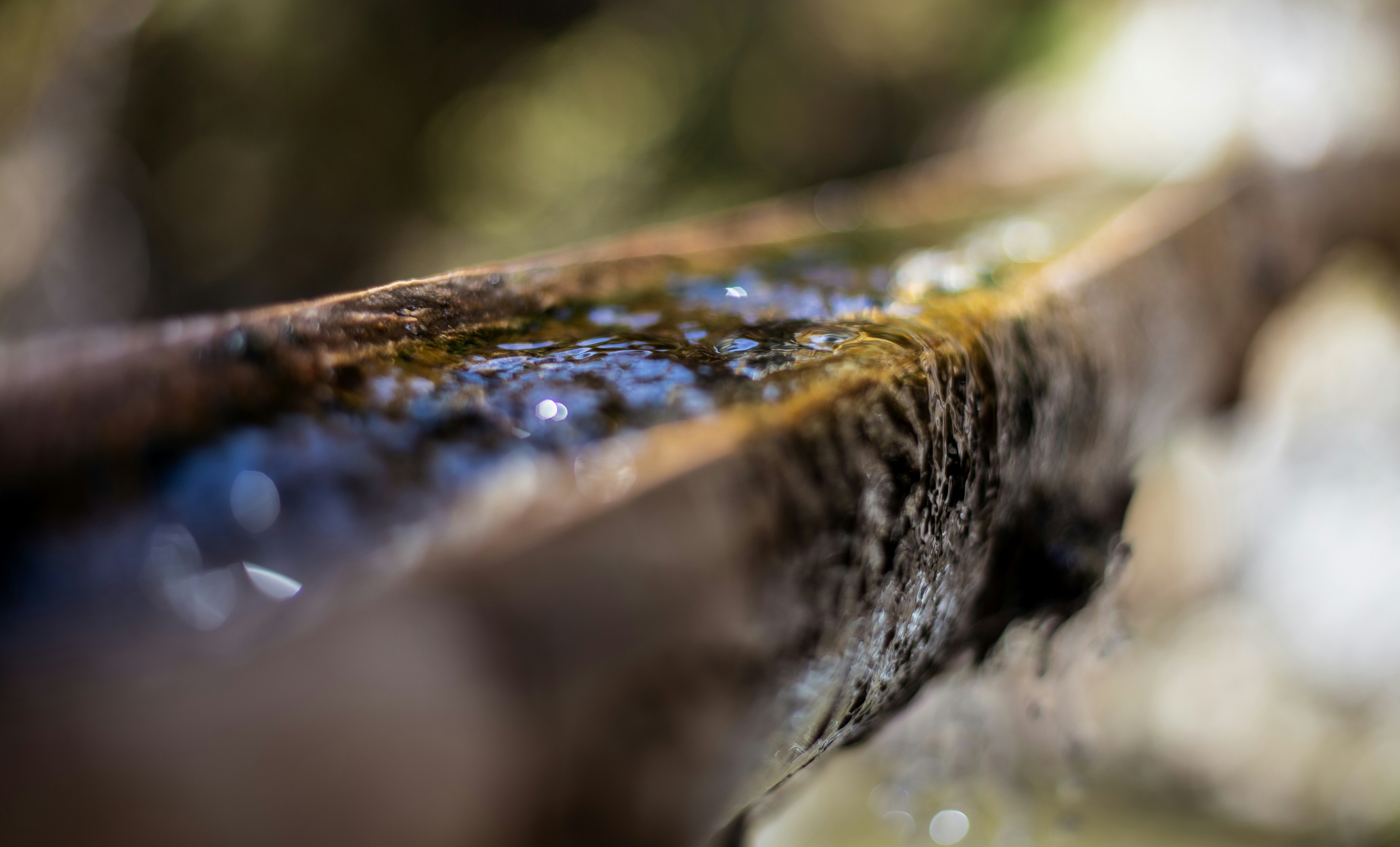 Water flowing through a wooden trough