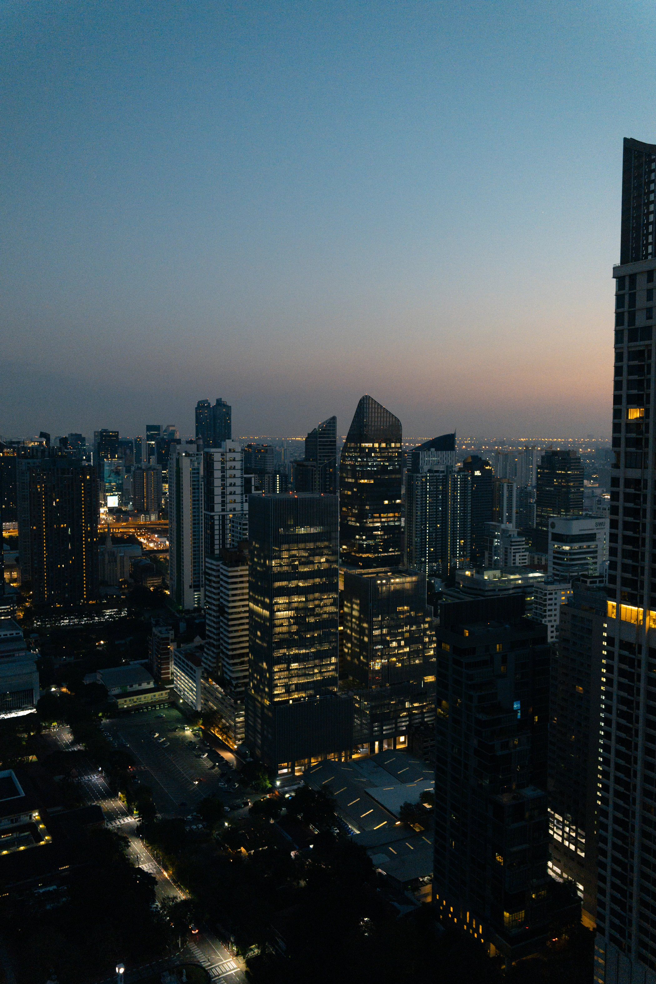 Bangkok skyline illuminated at dusk, Thailand