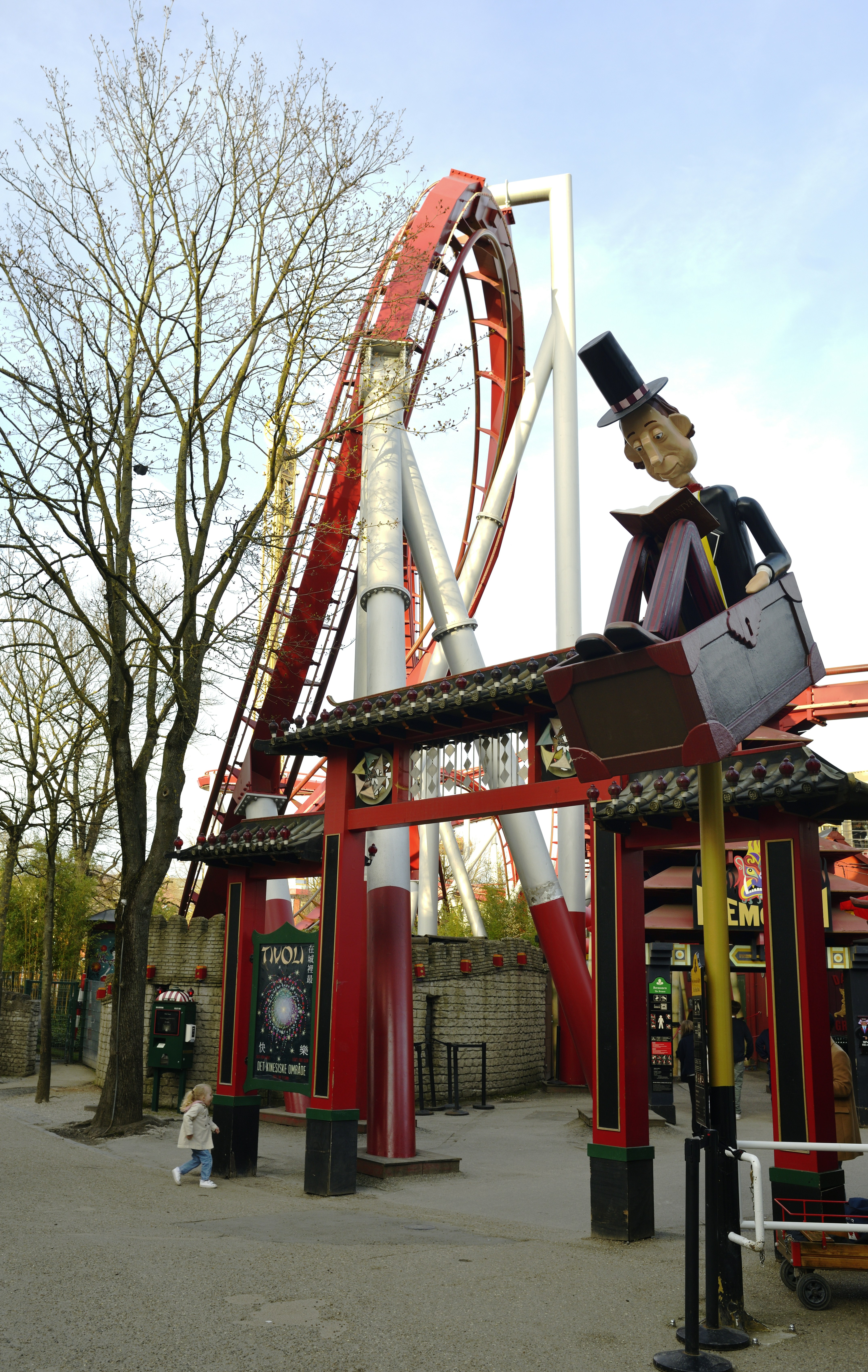 Roller coaster with japanese-style entrance and statue