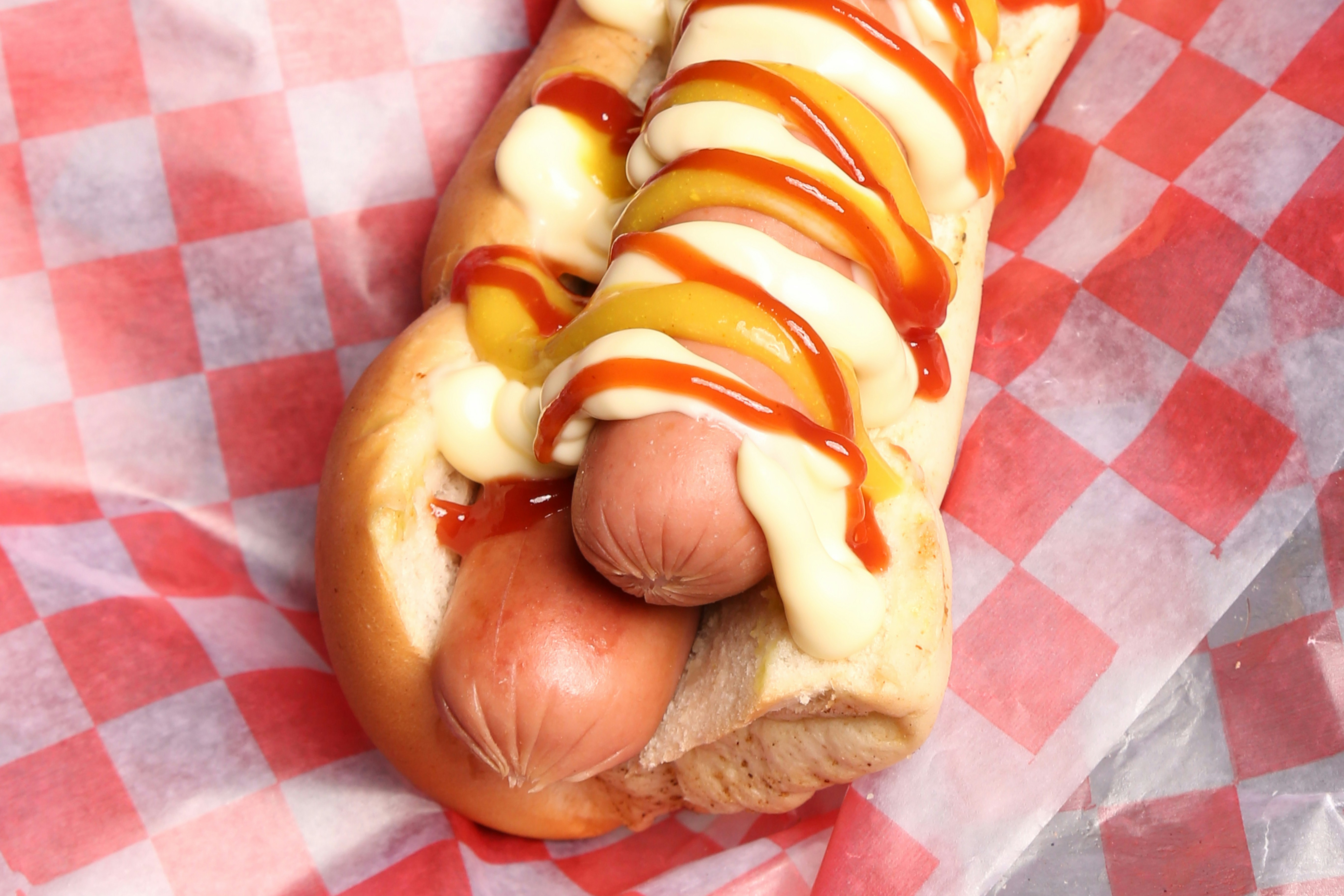 Hot dog with ketchup and mustard in bun