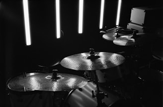Close-up of a drum set with dramatic lighting