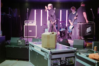 Band setting up equipment on a stage