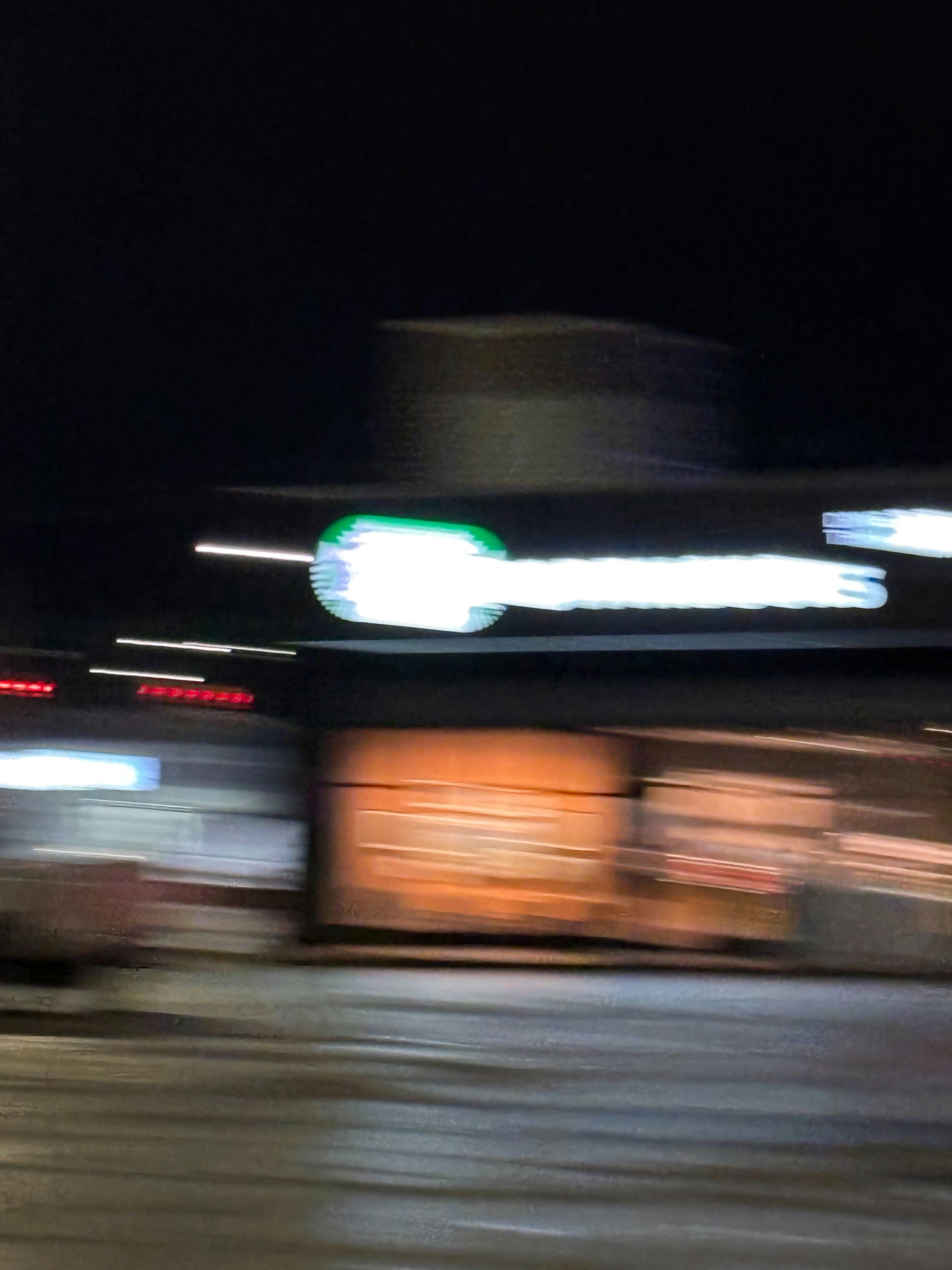 Blurry night view of a starbucks storefront