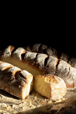 Freshly baked loaves of bread dusted with flour