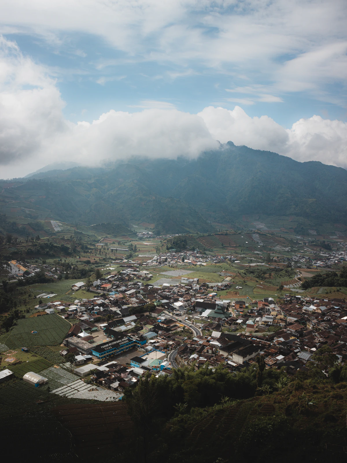 Mist-shrouded volcanic plateau and geothermal bubbling craters of Dieng