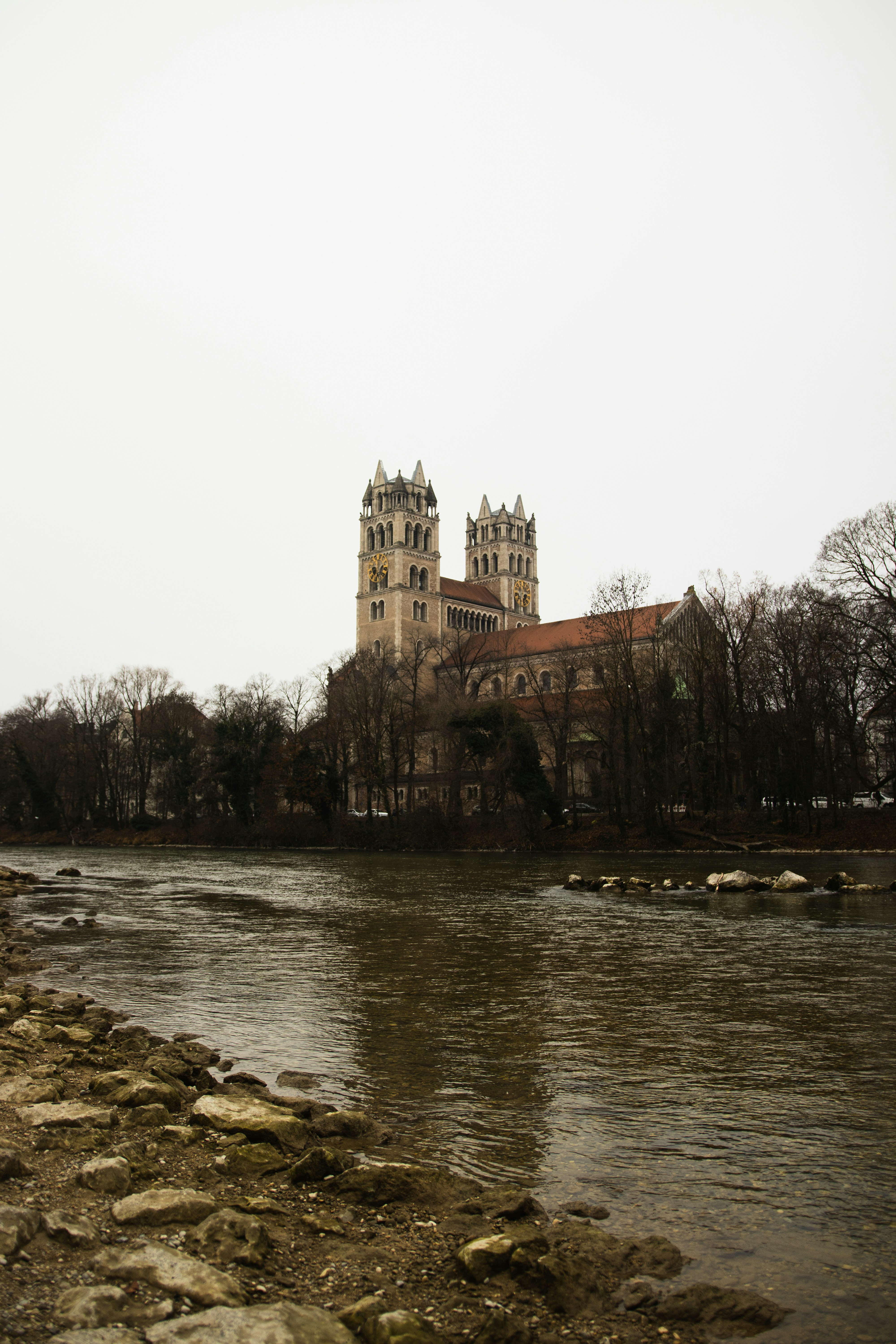 Majestic church building beside a flowing river