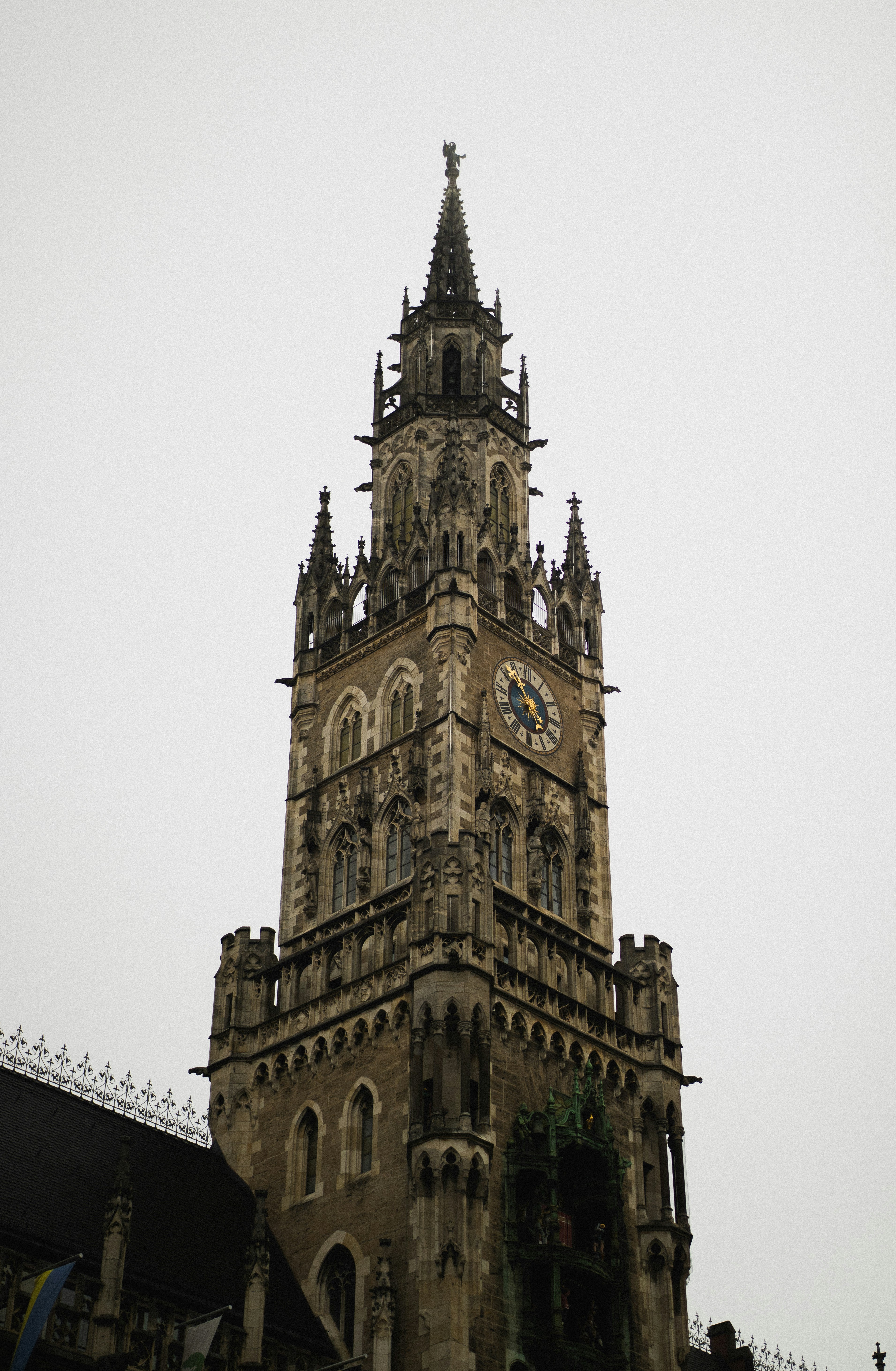Ornate clock tower against a cloudy sky