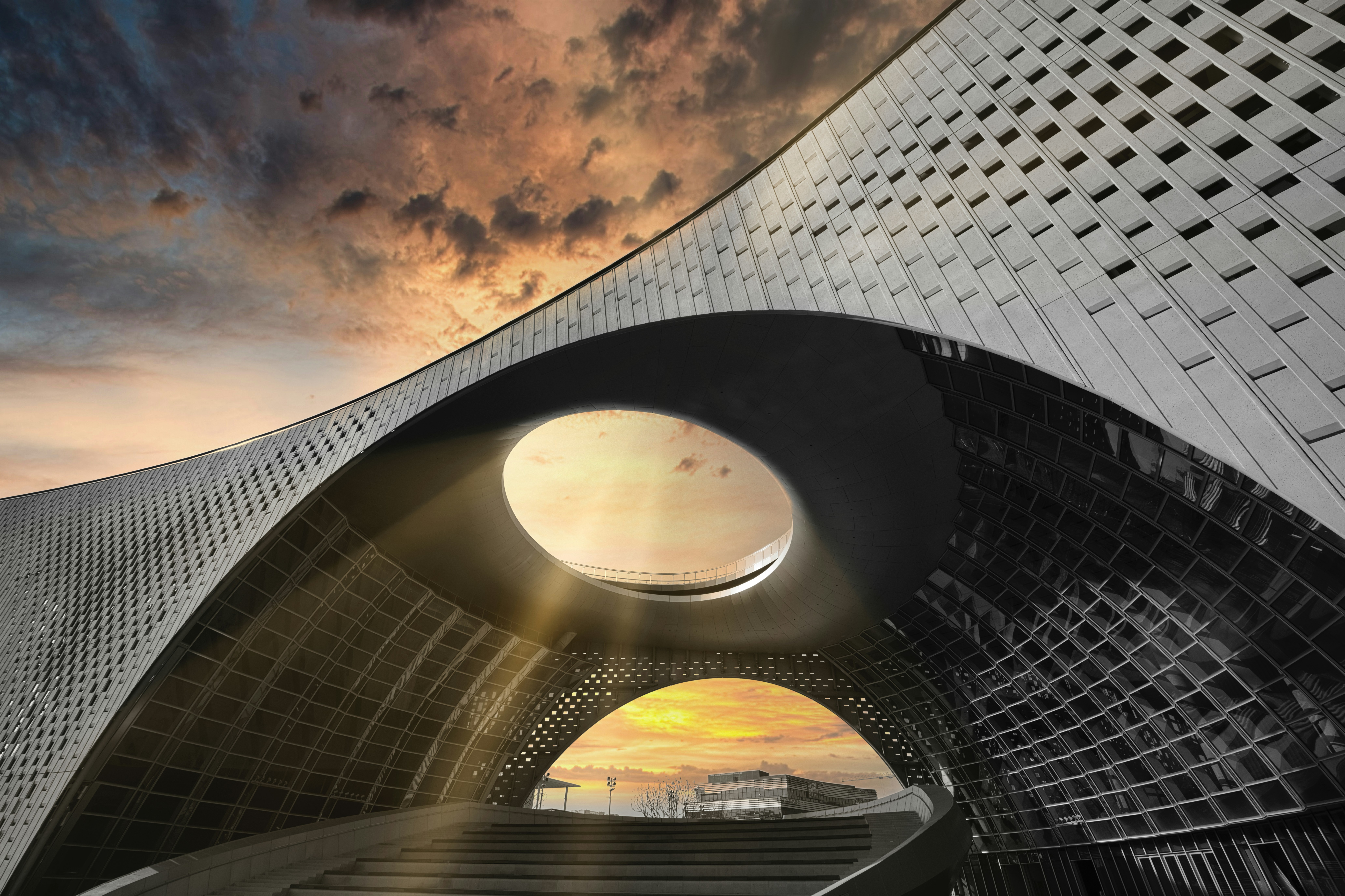 Modern architectural building with dramatic sunset sky
