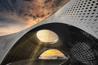 Modern architectural building with dramatic sunset sky