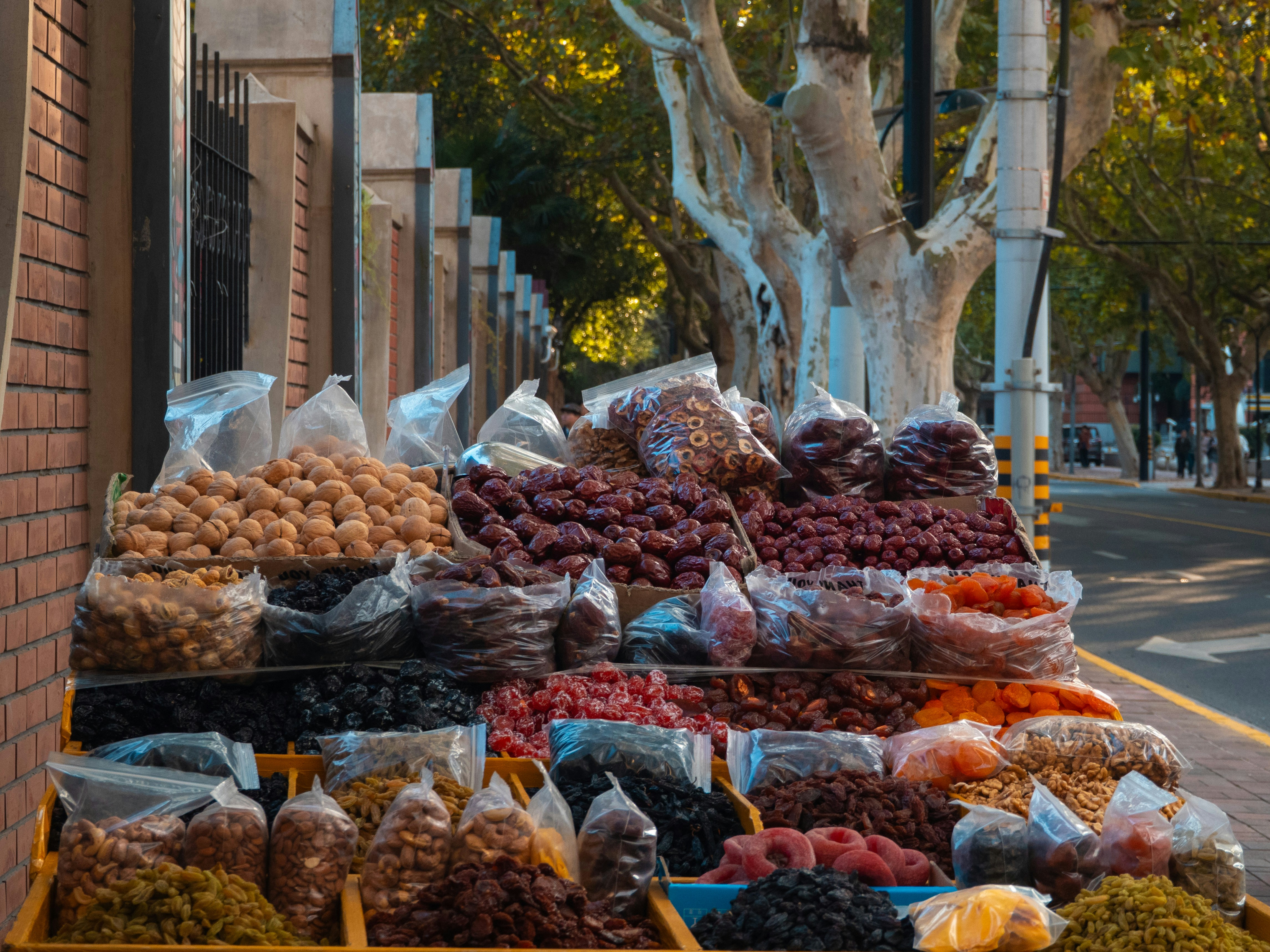 Outdoor stall selling various dried fruits and nuts