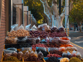 Outdoor stall selling various dried fruits and nuts