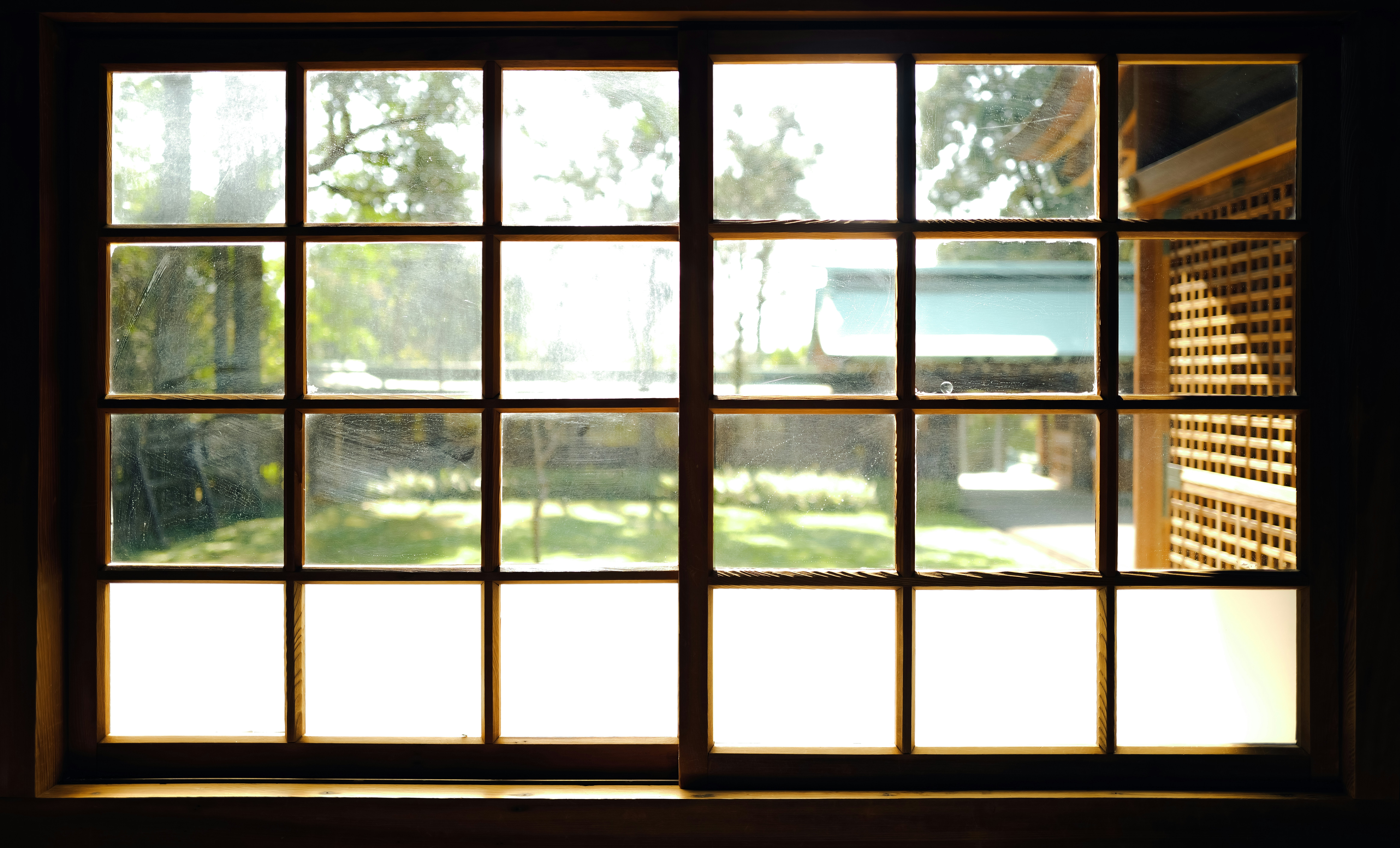 View through a window to a sunny garden