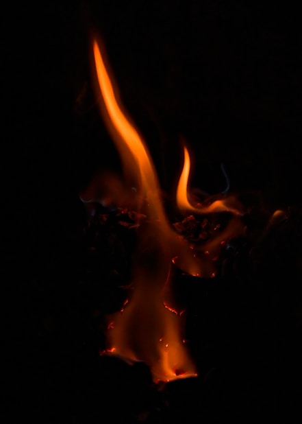 Orange flames burning in the dark